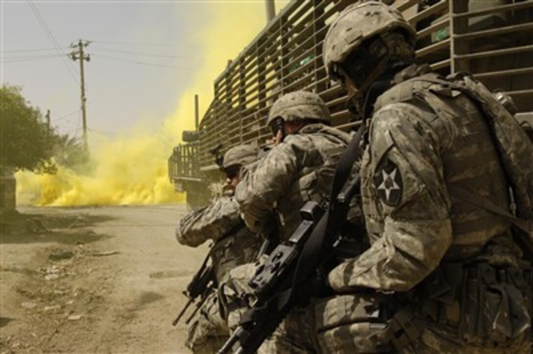 Soldiers from the 5th Battalion, 20th Infantry Regiment, 3rd Brigade, 2nd Infantry Division, attached to the 3rd Brigade Combat Team, 1st Cavalry Division, conduct their first mission in the Diyala province, engaging anti-Iraqi forces in Baqubah, Iraq, March 14, 2007. 