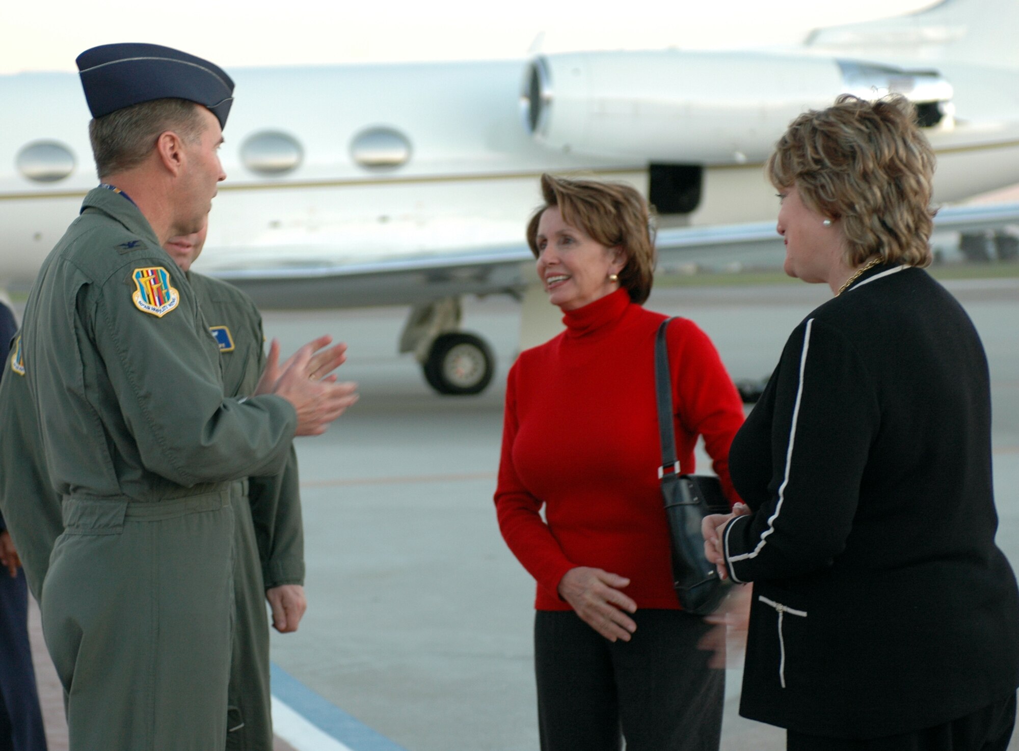 Col. Steve Arquiette, 60th Air Mobility Wing commander, speaks with Nancy Pelosi, (D-Calif.), Speaker of the House and Representative Ellen Tauscher, (D-Calif.), during their visit March 15. Travis was the first stop for Madame Speaker Pelosi and Mrs. Tauscher on their trip to California. (U.S. Air Force photo by Airman Kristen Rohrer)