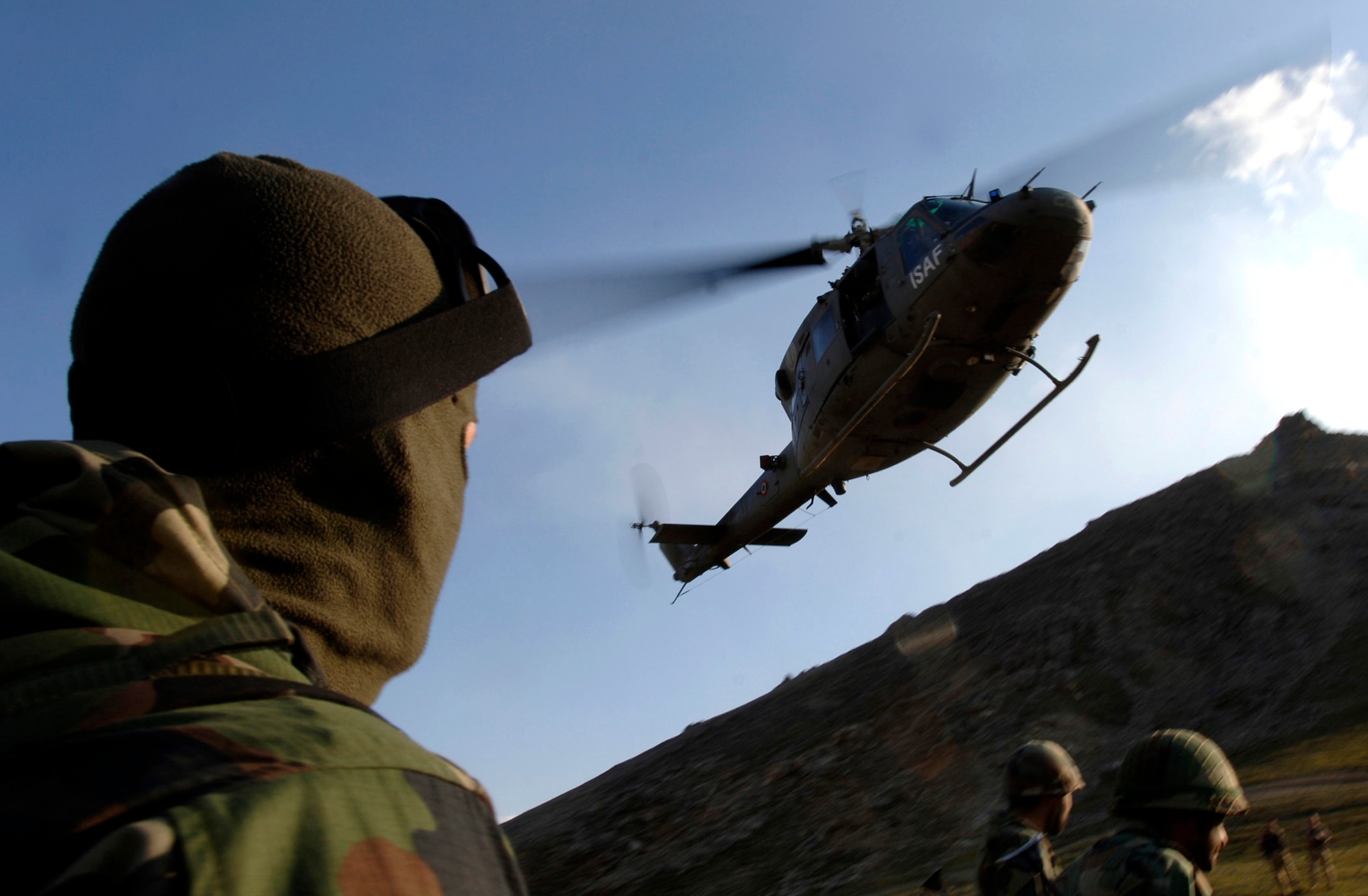A French International Security Assistance Force member awaits the arrival of an Italian UH-60 helicopter March 15 supporting a medical evacuation exercise being held at the Kabul Military Training Center in Afghanistan.  ISAF and DOD members help train ANA officer candidates on practical scenarios such as IED attacks, self-aid and buddy care and patient evacuation.  (U.S. Air Force photo/Tech. Sgt. Cecilio M. Ricardo Jr.)