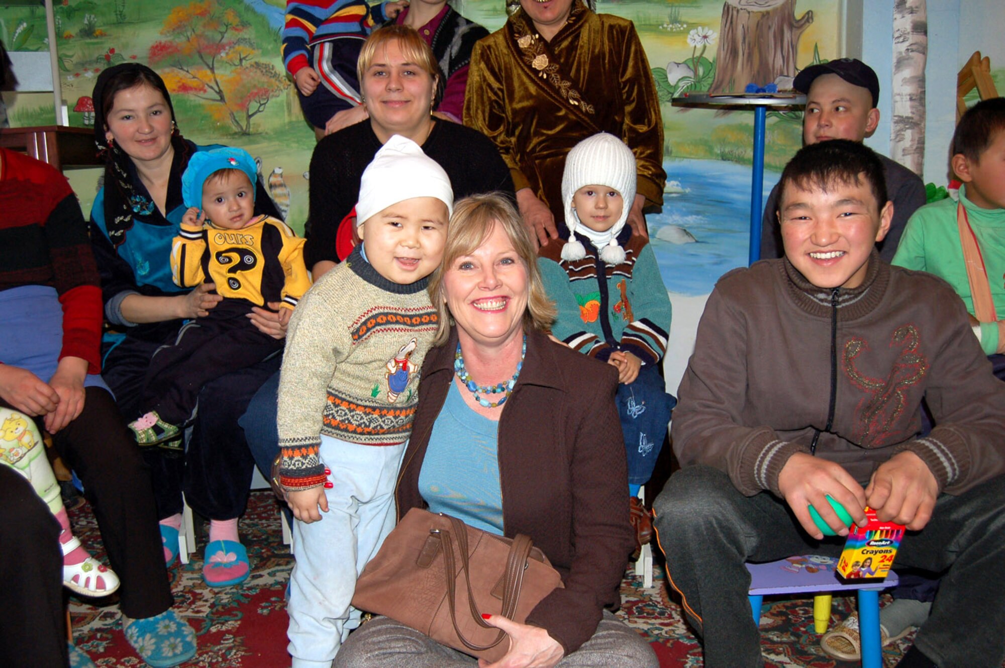 Suzie Schwartz, wife of Gen. Norton Schwartz, U.S. Transportation Command commander, spends time with patients from the Children's Cancer Center March 14 in Kyrgystan. She took part in the Manas Air Base Outreach Society trip while General Schwartz was here for high-level discussions on regional security and promoting further cooperation between the United States and the Kyrgyz Republic to help bring peace and prosperity to Afghanistan. (U.S. Air Force photo/Senior Master Sgt. Timothy Cook)

