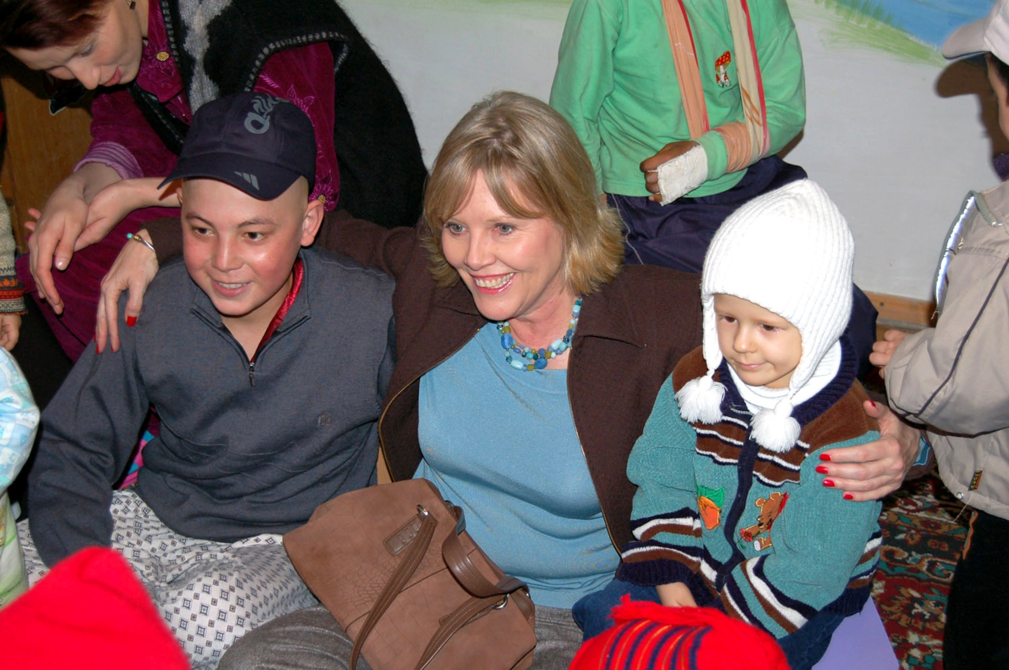 Suzie Schwartz, wife of Gen. Norton Schwartz, U.S. Transportation Command commander, spends time with patients at the Children's Cancer Center March 14 in Kyrgystan. She took part in the Manas Air Base Outreach Society trip while General Schwartz was here for high-level discussions on regional security and promoting further cooperation between the United States and the Kyrgyz Republic to help bring peace and prosperity to Afghanistan. (U.S. Air Force photo/Senior Master Sgt. Timothy Cook)