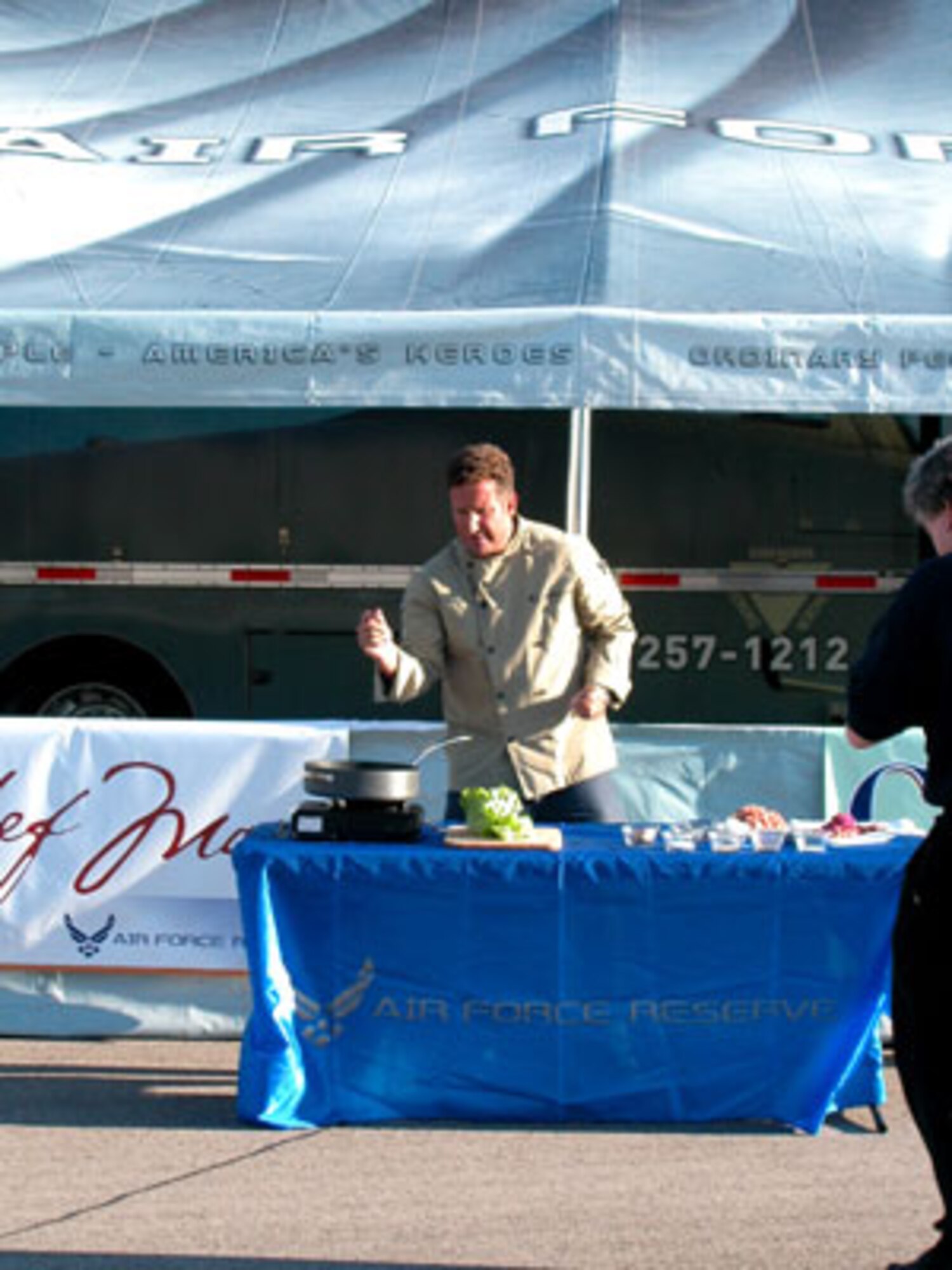 Chef Marc does a trial run of his own, preparing food outside the Air Force Reserve jet car trailer parked at March Air Reserve Base in order to get ready for the upcoming tour season in which he will be traveling along with the jet car. (U.S. Air Force photo by Maj. Don Traud)