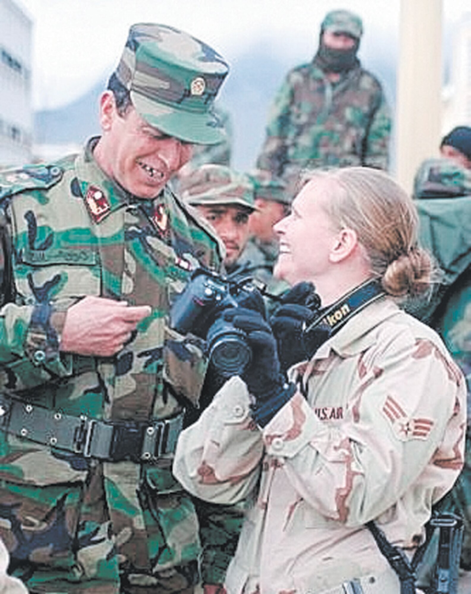 Senior Airman Stacia Zachary talks with an Afghan National Army soldier.