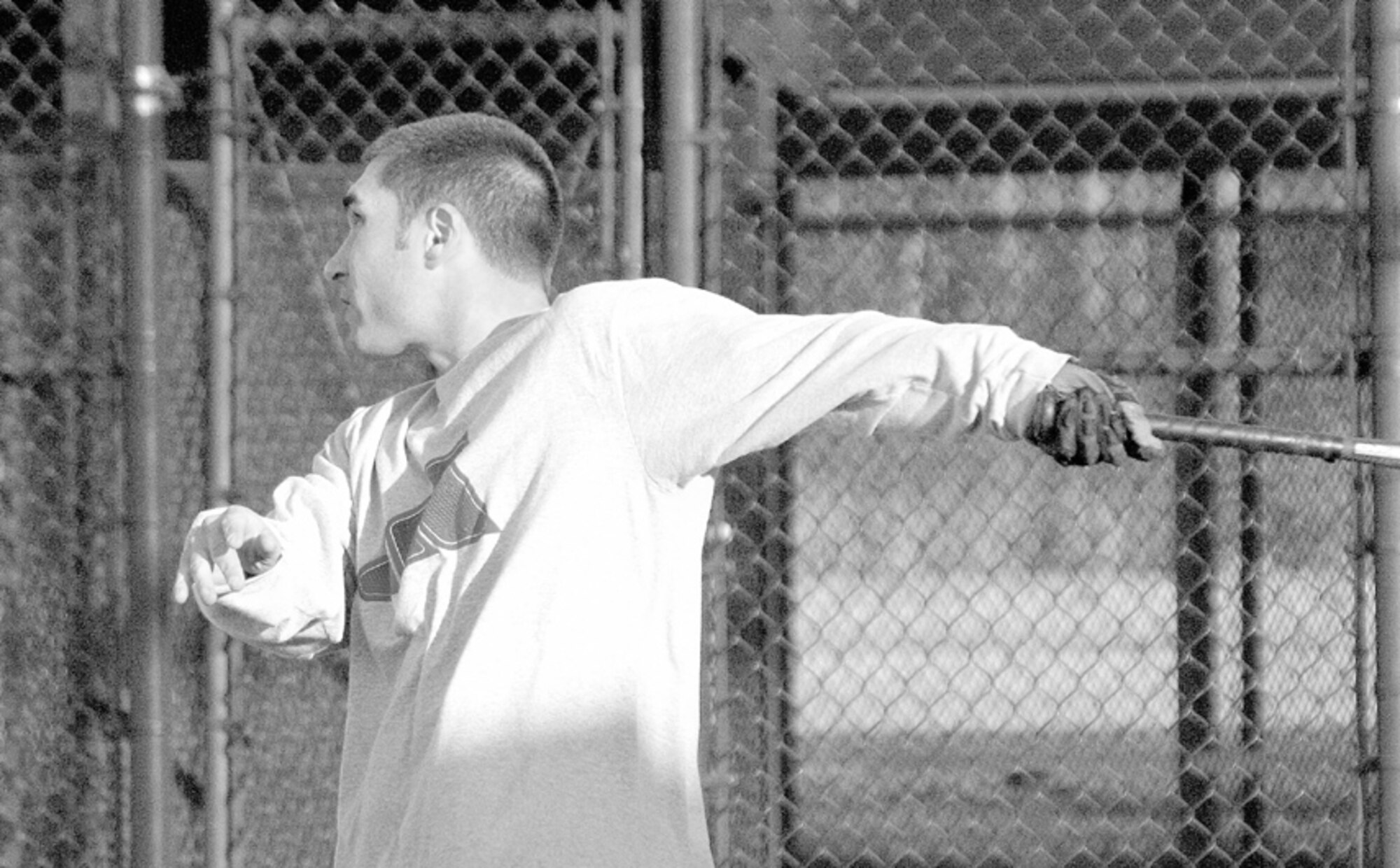 Tommy Edgar, 43rd Comptroller Squadron, displays his batting skills during the second day of tryouts for the Pope traveling softball team March 8.