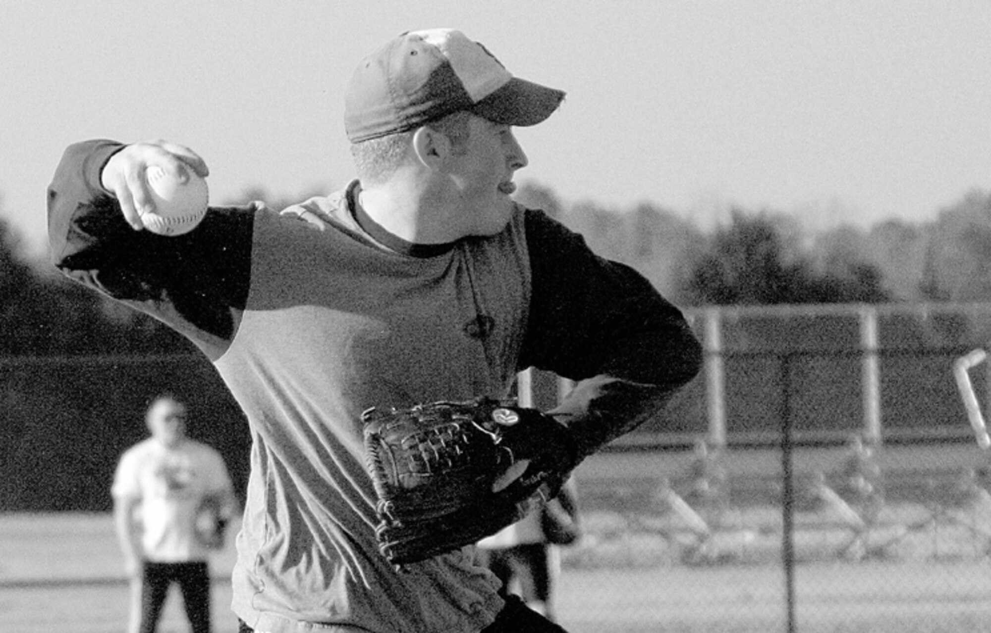 Justin Ford, 23rd Aircraft Maintenance Squadron, makes a play from third to first during tryouts for the Pope traveling softball team.