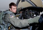 Capt. Lacy Gunnoe, 559th Flying Training Squadron T-37 instructor pilot student, runs the interior inspection checklist before a training mission. (U.S. Air Force photo by Melissa Peterson)