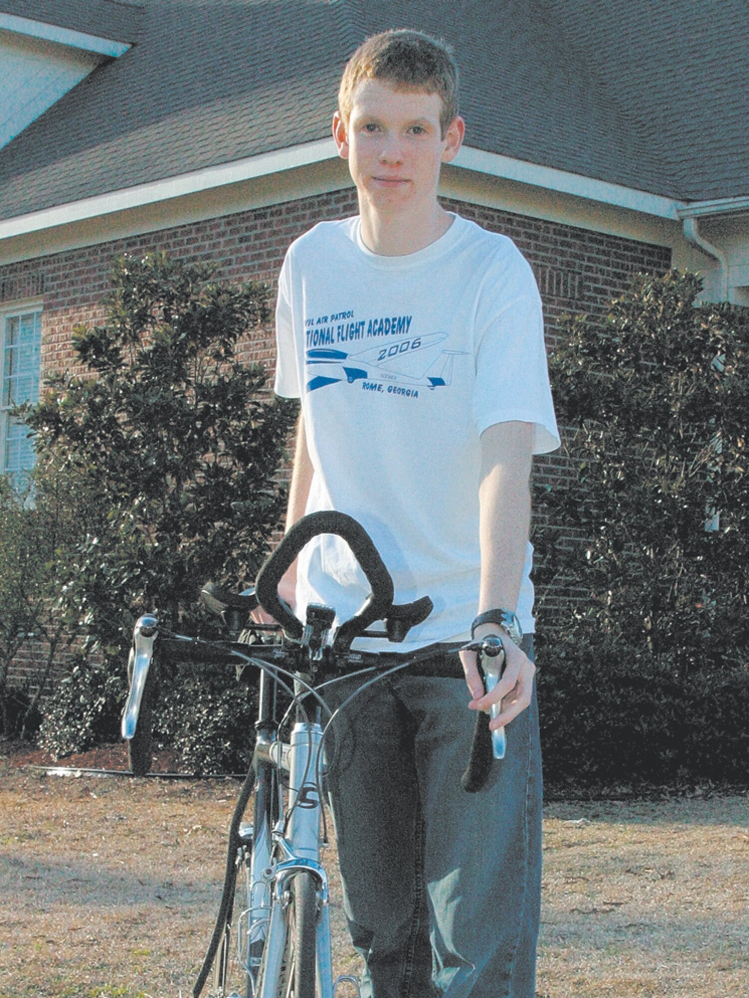Jonathon Lewis, who was recently appointed to teh United States Air Force Academy, shows off his triathlon bike. He was ranked 26th in the nation in 2004 in the 13- and 14-year-old triathlon category. He competes in various triathlon distances, including the Half-Ironman.