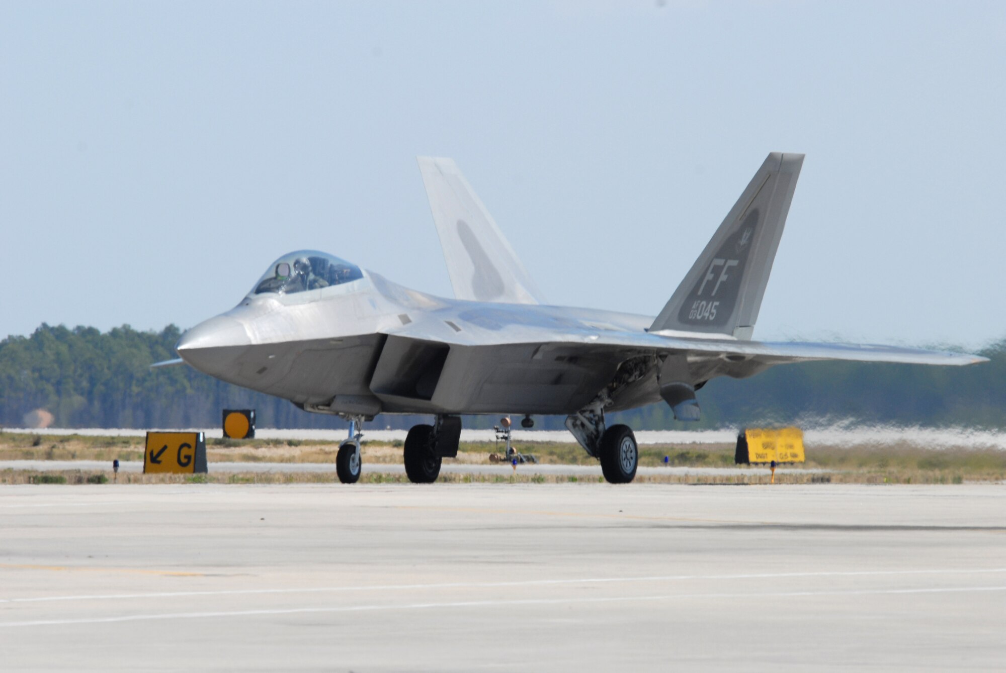 Capt. John Echols, 43rd Fighter Squadron pilot, taxies in one of the final two F-22 Raptors to join the 43rd FS assembly. The two aircraft from Langley AFB, Va., arrived here March 9 and 11. The 43rd FS and Aircraft Maintenance Unit now boast 29 Raptors to effectively accomplish their mission as the only F-22 training squadron in the Air Force.