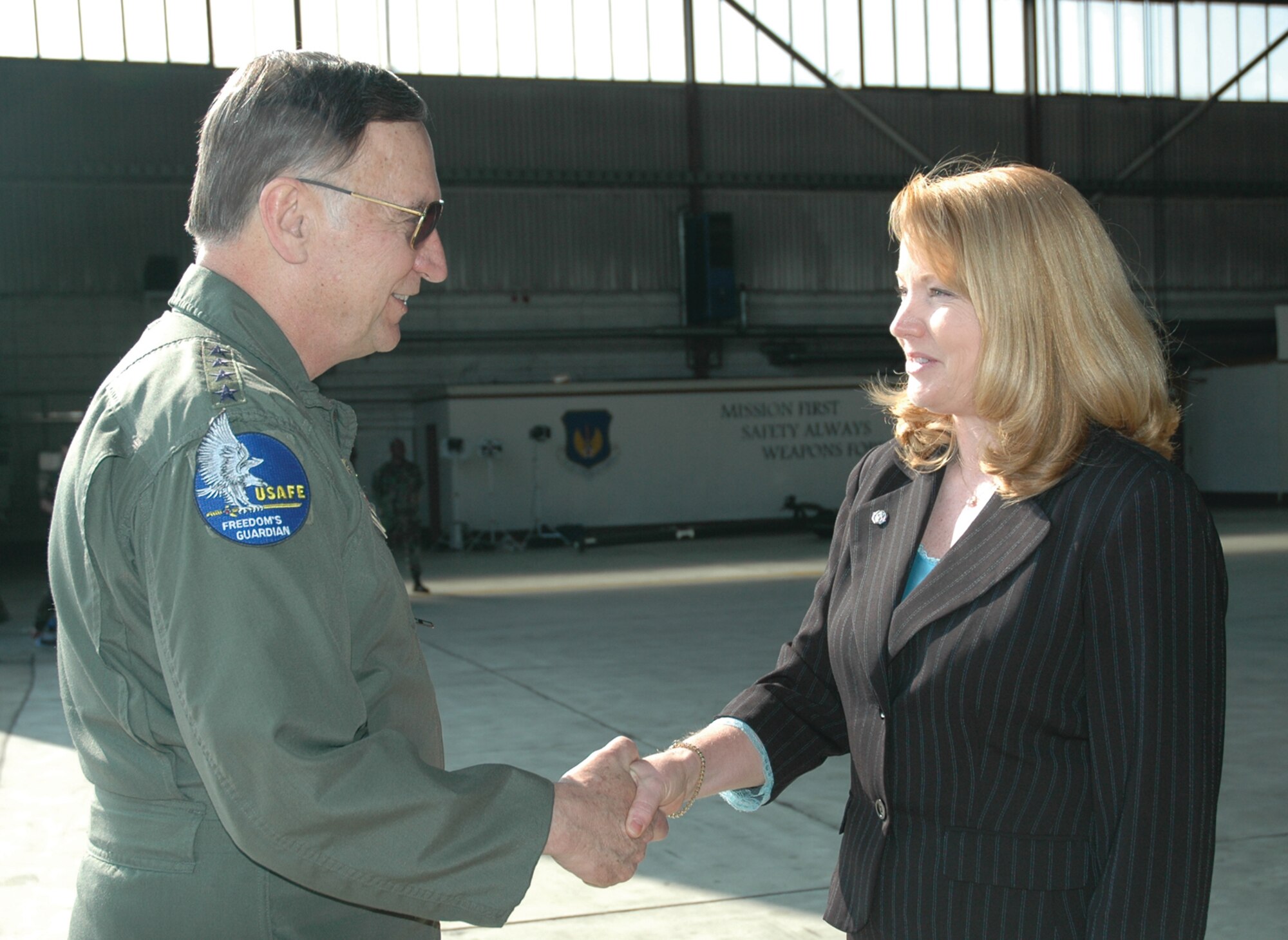 SPANGDAHLEM AIR BASE, Germany -- Gen. Tom Hobbins, U.S. Air Forces in Europe commander, meets Joan Siler, 52nd Mission Support Squadron, while at Spangdahlem Air Base to shoot an American Forces Network commercial here March 15.  