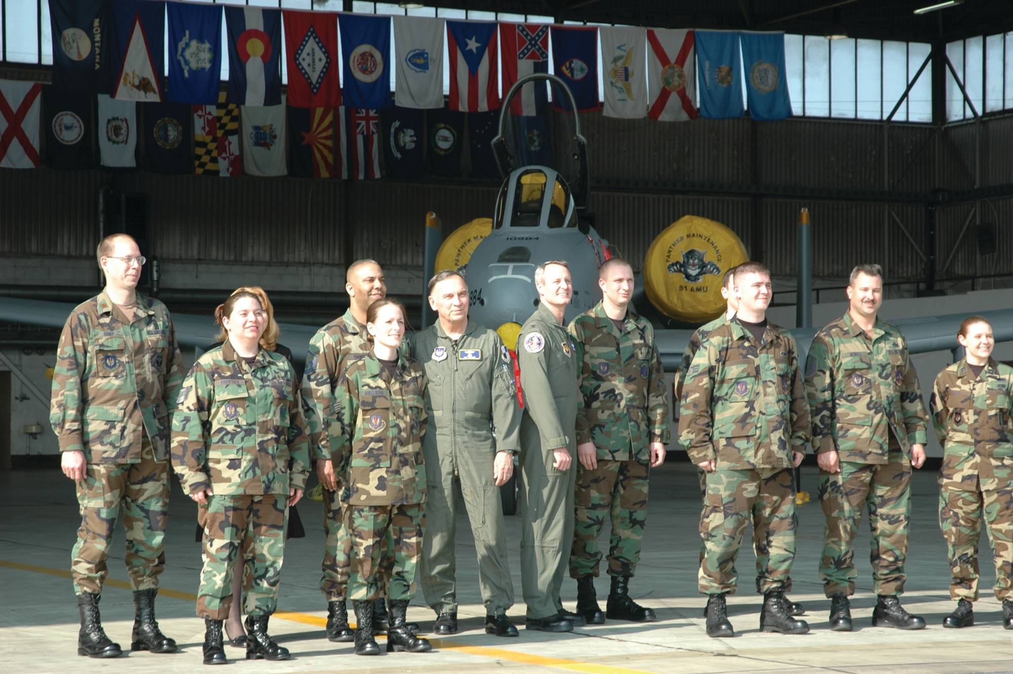 SPANGDAHLEM AIR BASE, Germany -- Members of Spangdahlem Air Base stand beside Gen. Tom Hobbins, U.S. Air Forces in Europe commander, while shooting an American Forces Network commercial here March 15.  