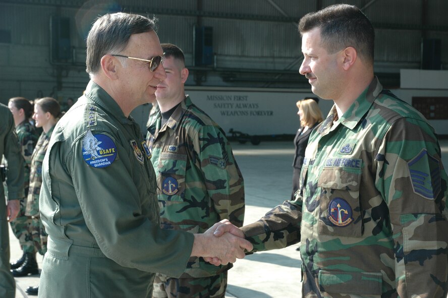 SPANGDAHLEM AIR BASE, Germany -- Gen. Tom Hobbins, U.S. Air Forces in Europe commander, meets Master Sgt. Andrew Jewell, 52nd Aircraft Maintenance Squadron, while at Spangdahlem Air Base to shoot an American Forces Network commercial here March 15.  