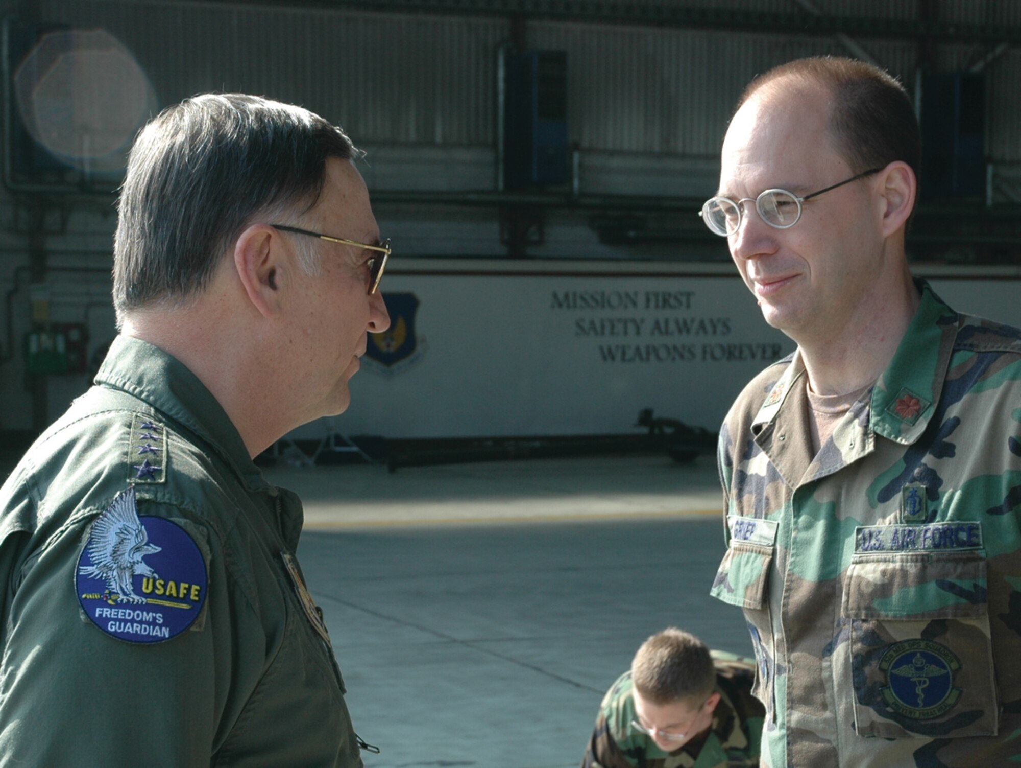 SPANGDAHLEM AIR BASE, Germany -- Gen. Tom Hobbins, U.S. Air Forces in Europe commander, meets Maj. Stephen Griep, 52nd Medical Operations Squadron, while at Spangdahlem Air Base to shoot an American Forces Network commercial here March 15.