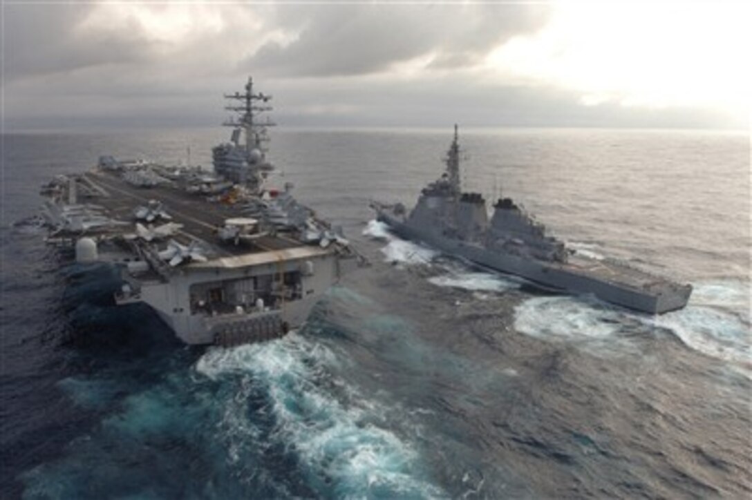 USS Ronald Reagan (CVN 76) connects to JS Myoko (DDG 175) of the Japan Maritime Self Defense Force during a refueling at sea evolution March 17, 2007. The Ronald Reagan Carrier Strike Group is under way on a surge deployment in support of U.S. military operations in the Western Pacific.