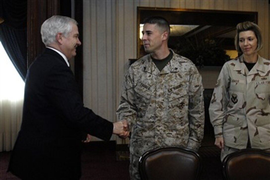 Secretary of Defense Robert M. Gates (left) meets with enlisted service members during an informal roundtable discussion at MacDill Air Force Base, Fla., on March 16, 2007.  Gates spoke with the troops who had all been deployed to Iraq or Afghanistan to learn about their concerns and to answer any of their questions.  