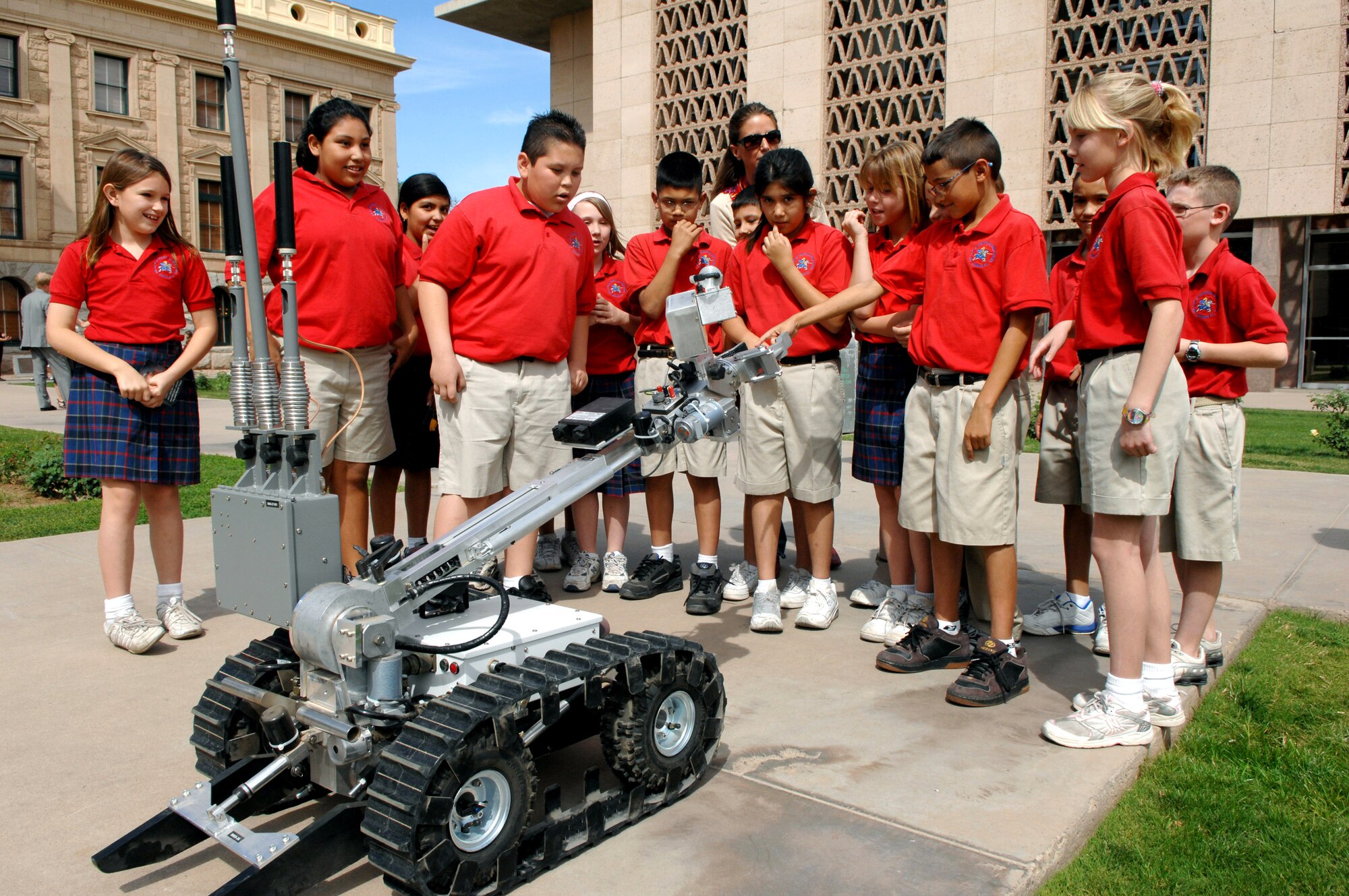 Students from Our Lady of Perpetual Help check out one of the explosive ordnance disposal robots during a field trip to the Arizona state capital in Phoenix. The explosive ordnance disposal specialists from Luke Air Force Base brought the robot to the capital to help kick off Air Force Week. (U.S. Air Force photo/Staff Sgt. Brian Ferguson) 