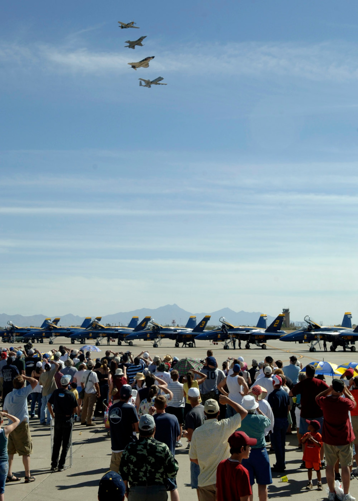 The Heritage Flight -- a P-51 Mustang, an F-16 Fighting Falcon, an F-4 Phantom, and an A-10 Thunderbolt II -- fly by March 18 during the 2007 Aerospace and Arizona Days air show at Davis-Monthan Air Force Base, Ariz.  The two-day air show offered public an up-close look at military and civilian aerial demonstrations and static-display aircraft from across the U.S. The theme for this year's show was "Davis-Monthan and Tucson: 80 Years of Airpower for America!"  (U.S. Air Force photo/Senior Airman Christina D. Ponte)