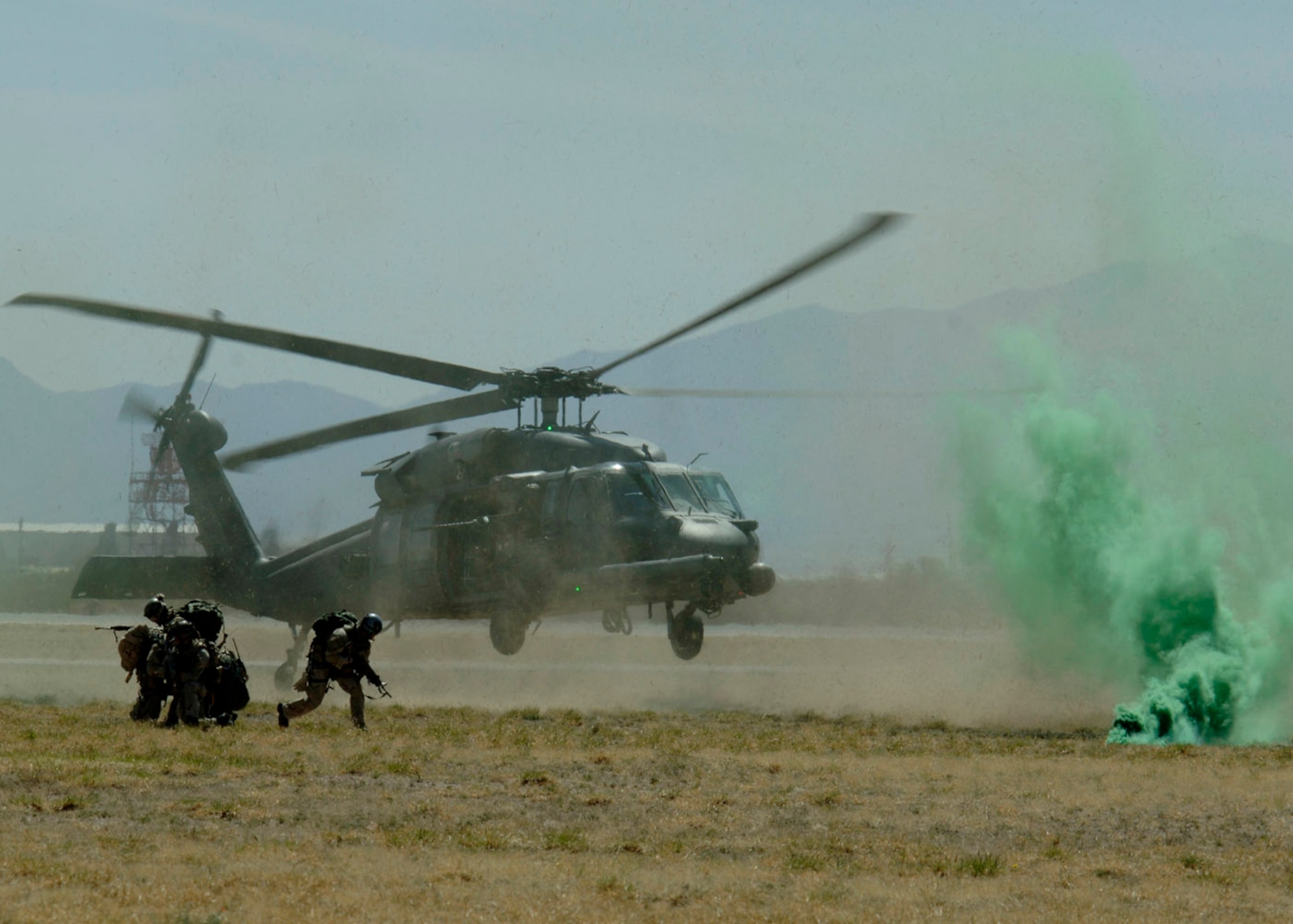 Pararescuemen from the 48th Rescue Squadron prepare to be picked up by an HH-60 Pave Hawk helicopter as part of a combat search and rescue demonstration March 18 during the 2007 Aerospace and Arizona Days air show at Davis-Monthan Air Force Base, Ariz.  The two-day air show offered public an up-close look at military and civilian aerial demonstrations and static-display aircraft from across the U.S. The theme for this year's show was "Davis-Monthan and Tucson: 80 Years of Airpower for America!"  (U.S. Air Force photo/Senior Airman Christina D. Ponte)