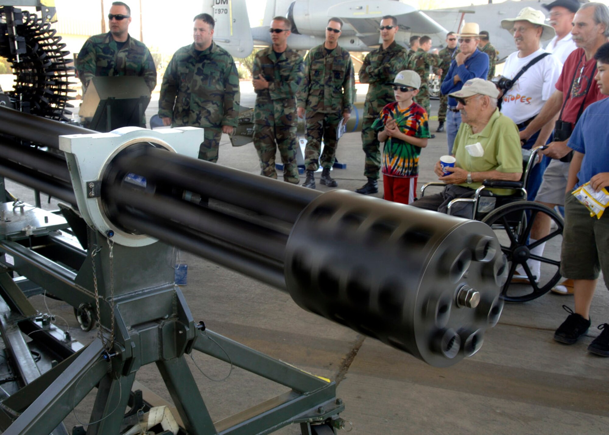 Tech Sgt. Cory Staudinger demonstrates the capabilities of the 30mm GAU-8/A Gatling gun March 18 during the 2007 Aerospace and Arizona Days air show at Davis-Monthan Air Force Base, Ariz.  The seven-barrel Gatling gun, found on the A-10 Thunderbolt II, can fire 3,900 rounds a minute and can defeat an array of ground targets including tanks.  Sergeant Staudinger is a weapons instructor assigned to the 372nd Training Squadron.  (U.S. Air Force photo/Senior Airman Christina D. Ponte)