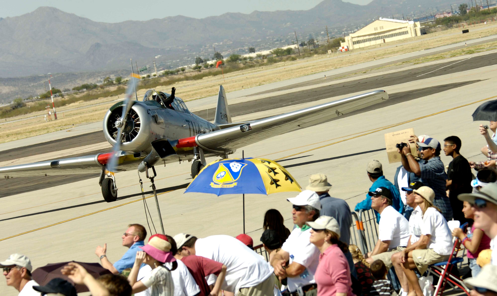A T-6 Texan taxis by the crowd March 18 during the 2007 Aerospace and Arizona Days air show at Davis-Monthan Air Force Base, Ariz.  The two-day air show offered public an up-close look at military and civilian aerial demonstrations and static-display aircraft from across the U.S. The theme for this year's show was "Davis-Monthan and Tucson: 80 Years of Airpower for America!" (U.S. Air Force photo/Senior Airman Jesse M. Shipps)