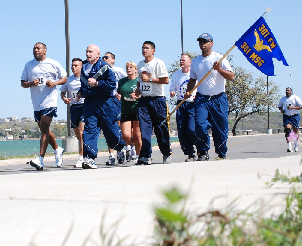 Nearly two dozen 301st Fighter Wing members and their families participated in this year's Naval Air Station Joint Reserve Base Fort Worth Spring Fling 5k Fun Run March 16. Runners and walkers took to the beautiful weather in ages ranging from toddler to near senior citizen. 301st Mission Support Group's Jerry Munoz finished the 3.1-mile course in 19:15, giving him second place finish overall and first place in his age group. (U.S. Air Force Photo/Tech. Sgt. Julie Briden-Garcia)