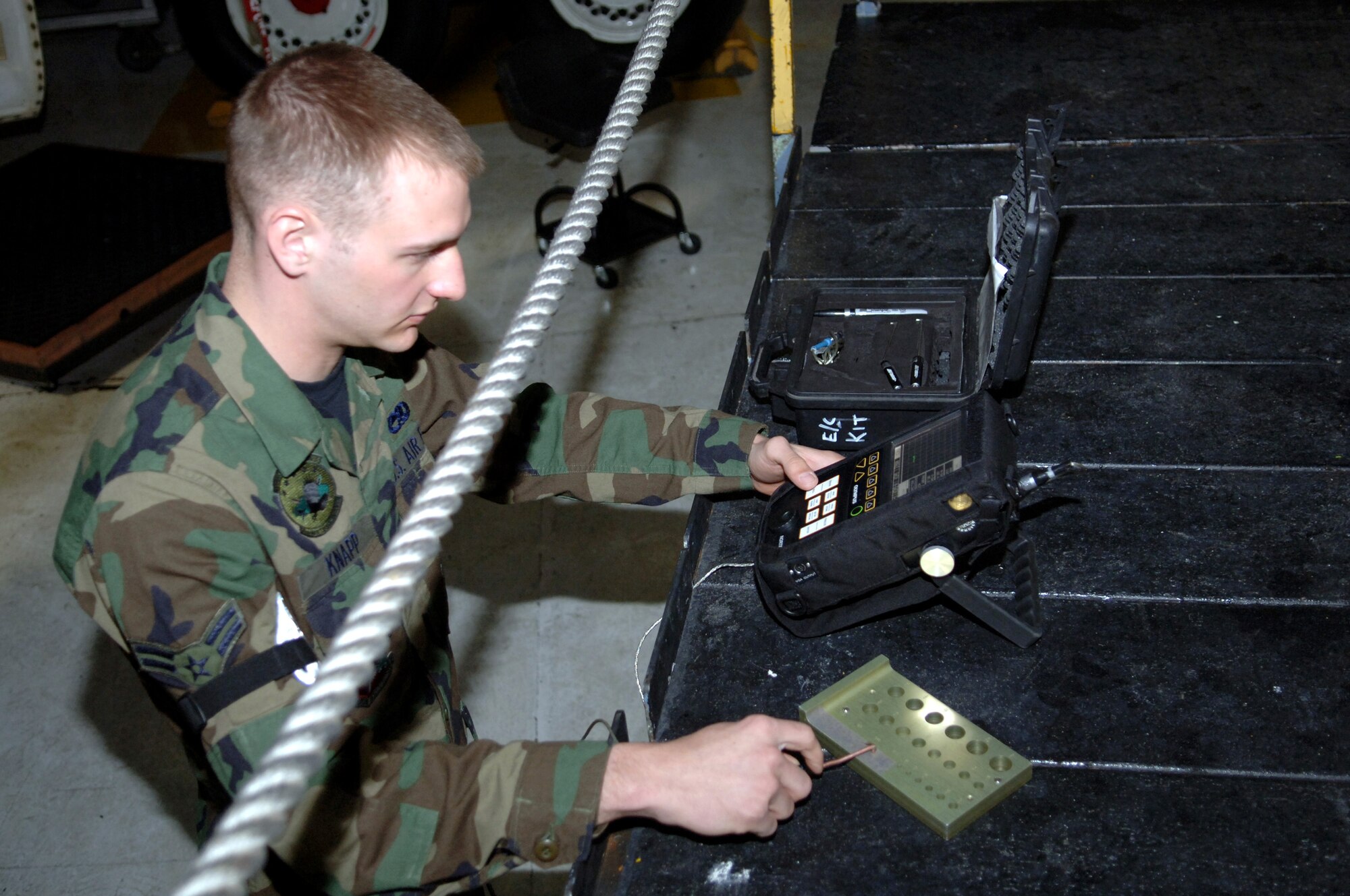 Airman 1st Class Trevor Knapp starts the Nortec 2000D to check for flaws and cracks on a B-1B Lancer at Ellsworth Air Force Base, S.D. Airman Knapp is a nondestructive inspections technician with the 28th Maintenance Squadron. (U.S. Air Force photo/Airman 1st Class Angela Ruiz)