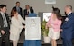 General Duncan J. McNabb, commander of Air Mobility Command, watches as Carmen Mikolajcik reveals the plaque honoring her husband, retired Brig. Gen. Thomas R. Mikolajcik during a formal ceremony for the new Mikolajcik Engineering Laboratory Center located on Naval Weapons Station Charleston March 16. Construction is expected to be completed in June 2007.  (U.S. Air Force Photo by Staff Sgt. Marie Cassetty)