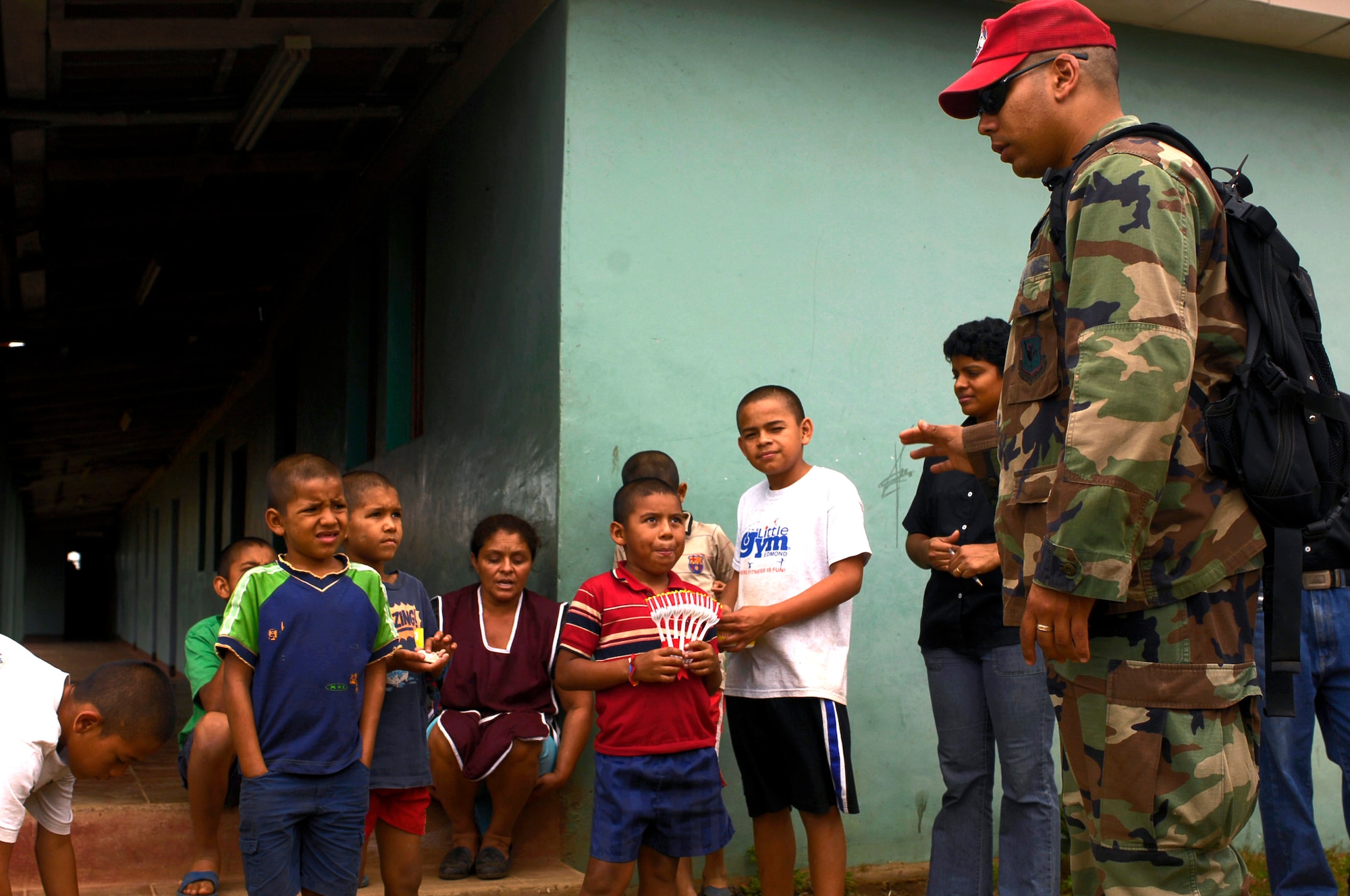 Capt. Carlos Diaz says goodbye after he and two other Airmen delivered food to the ABC Feed the Children Orphanage, near San Taresa, Nicaragua.  Captain Diaz is a public affairs officer participating in New Horizons-Nicaragua 2007, a $7.25 million joint U.S. and Nicaraguan military humanitarian and training exercise that will provide a new school and medical clinic, as well as free health and veterinary care, giving aid and strengthening bonds between the two nations. (U.S. Air Force photo/Staff Sgt. Jason T. Bailey)