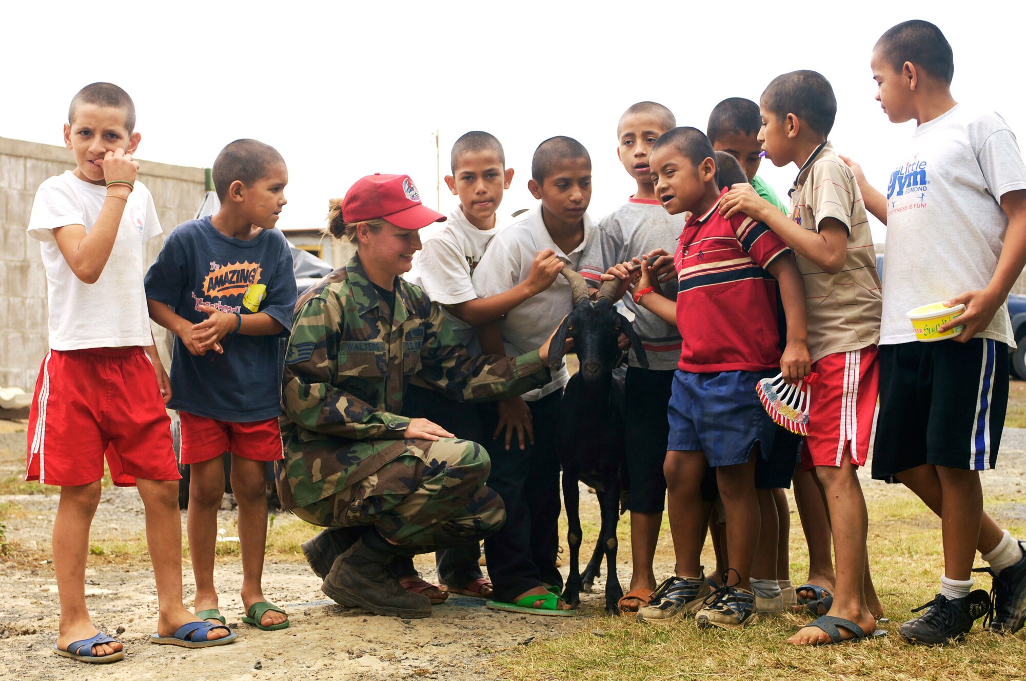 These boys show off their goat to Staff Sgt. Holly Walters shortly after she and two other Airmen delivered food to the ABC Feed the Children Orphanage near San Taresa, Nicaragua.  Sergeant Walters is a services NCO participating in New Horizons-Nicaragua 2007, a $7.25 million joint U.S. and Nicaraguan military humanitarian and training exercise that will provide a new school and medical clinic, as well as free health and veterinary care, giving aid and strengthening bonds between the two nations. (U.S. Air Force photo/Staff Sgt. Jason T. Bailey)