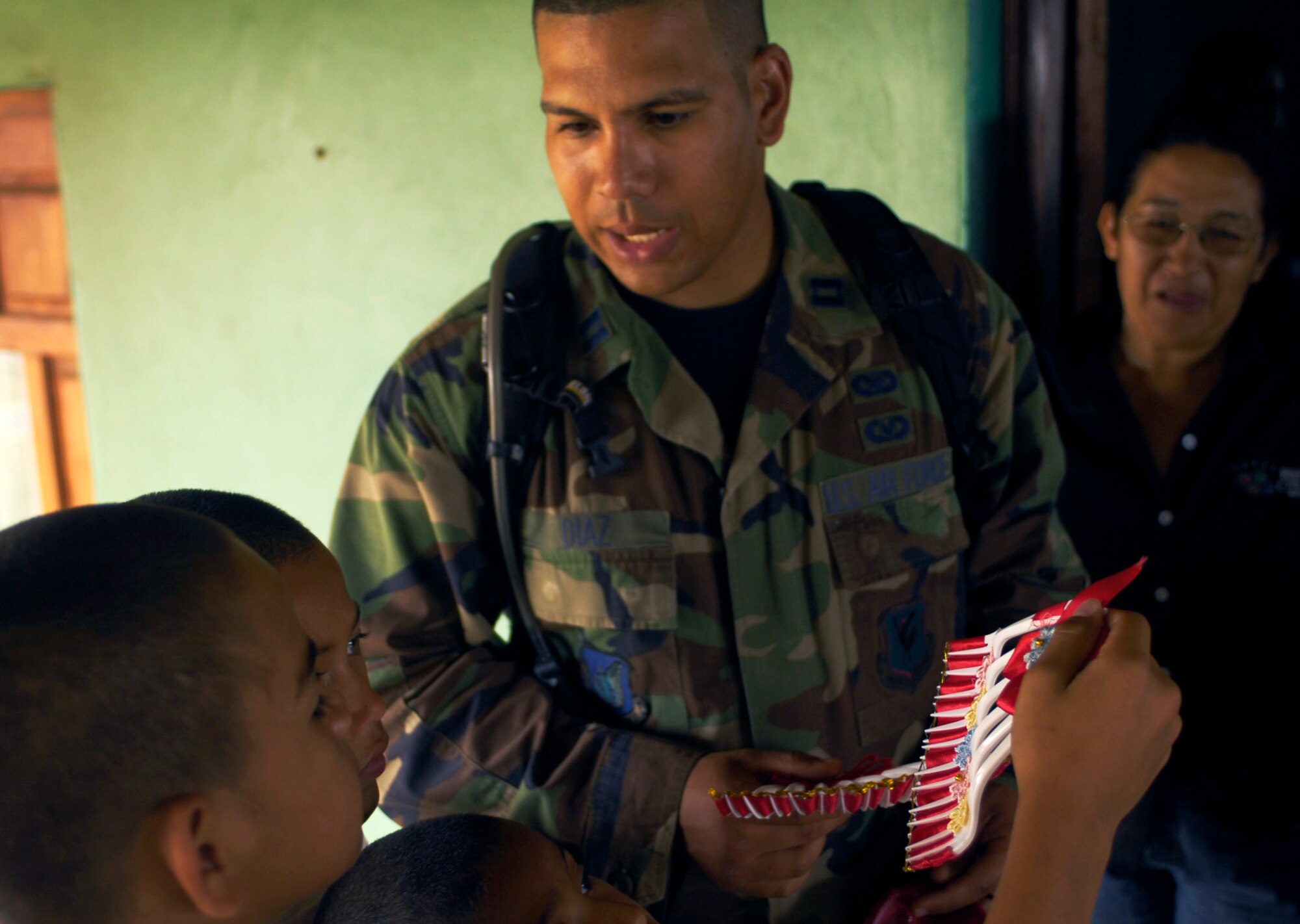 Capt. Carlos Diaz wishes a happy birthday to an orphan during a party at the ABC Feed the Children Orphanage near San Taresa, Nicaragua.  Captain Diaz is a public affairs officer participating in New Horizons-Nicaragua 2007, a $7.25 million joint U.S. and Nicaraguan military humanitarian and training exercise that will provide a new school and medical clinic, as well as free health and veterinary care, giving aid and strengthening bonds between the two nations. (U.S. Air Force photo/Staff Sgt. Jason T. Bailey)