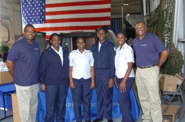 Tech. Sgts. Herman V. Woodard (far left) and Gregory Boyd (far right), Air Force Reserve recruiters for the 94th Airlift Wing, take time for a smile with Air Force JROTC cadets during JROTC Week, March 12-15, at Dobbins Air Reserve Base. "The Air Force Reserve gives our young a positive start with enhanced basic life skills and direction for their future," said Sergeant Woodard.  "Seeing our military members in action dispels negative myths and helps our JROTC cadets understand the importance of citizenship." 
