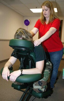SHAW AIR FORCE BASE, S.C. -- Message and bodywork therapist Donna Dunn gives Staff Sgt. Andrea Langham, 20th Medical Operations Squadron medical technician, a massage March 15 during the Women's Health Fair. The 20th Medical Group hosted the event to help educate women about preventive health and parenting support services. (U.S. Air Force photo/Senior Airman John Gordinier)