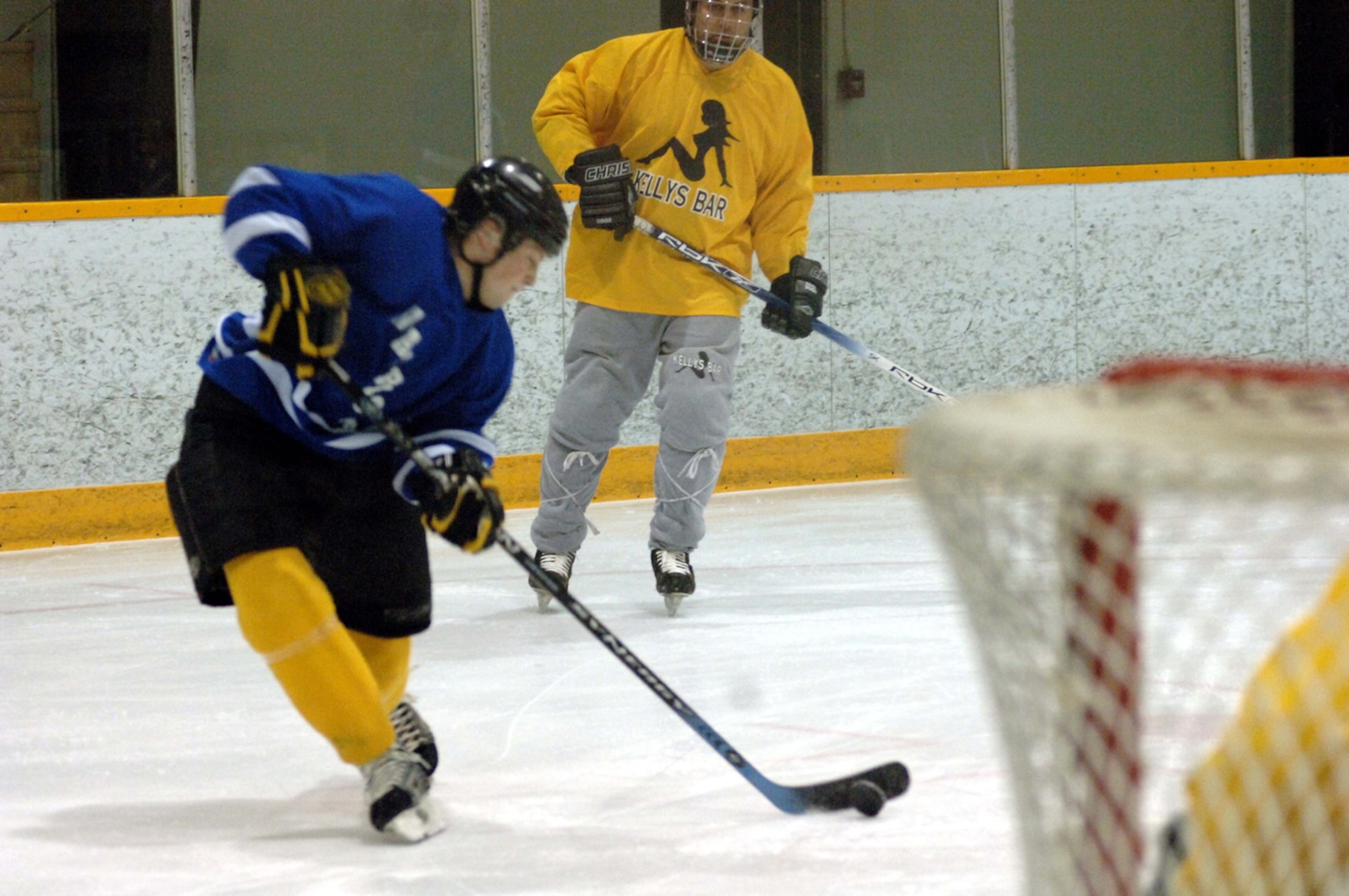 GRAND FORKS AIR FORCE BASE, ND -- Centerman Eric Schoenhals from the Warriors powers toward the Kelly's Bar goal during a game held March 14 in Grand Forks (U.S. Air Force photo/Tech. Sgt. Joseph Kapinos).