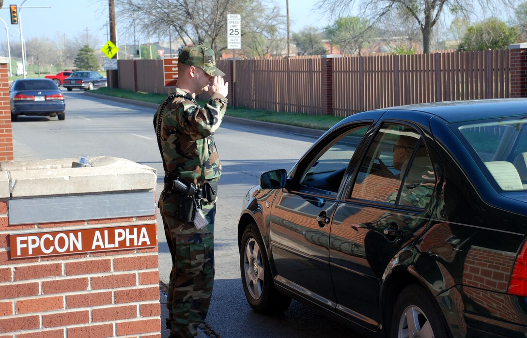 Airman Nathaniel Woollard, a member of the 82nd Logistics Readiness Squadron currently serving as a 82nd Security Forces augmentee, salues an arriving officer March 15. Augmentees like Airman Woollard are essential in helping the 82nd SFS achieve its mission. (U.S. Air Force photo/Airman 1st Class Jacob Corbin)