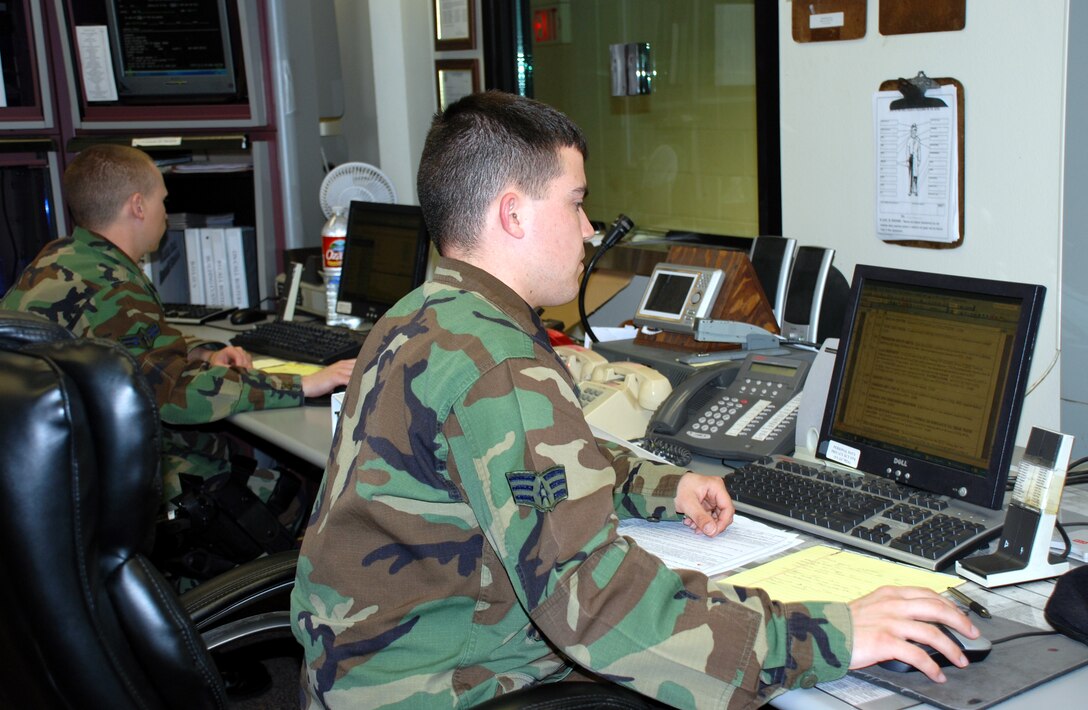 Senior Airman Joshua McFerrin and Airman 1st Class Caleb Ferguson man the law enforcement desk at the 82nd Security Forces Squadron March 16. (Airman 1st Class Jacob Corbin)