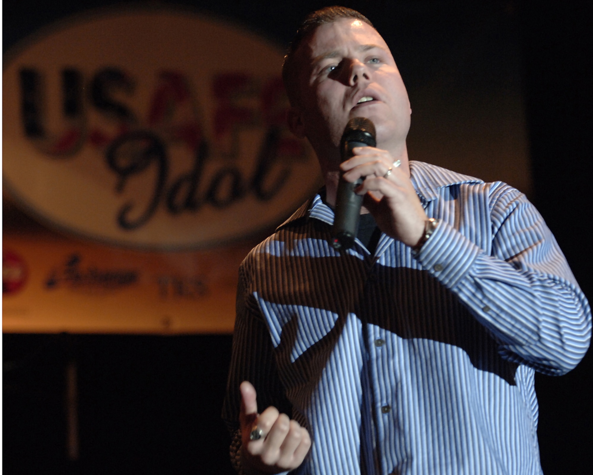 Staff Sgt. Jeff Nevison excites the crowd as he preforms during the USAFE Idol contest at the club March 16.  Sergeant Nevison took first in the contest Friday night and will go to Ramstein to represent Incirlik Air Base for the next round of competition. (U. S. Air Force Photo by Airman First Class Nathan W. Lipscomb)
