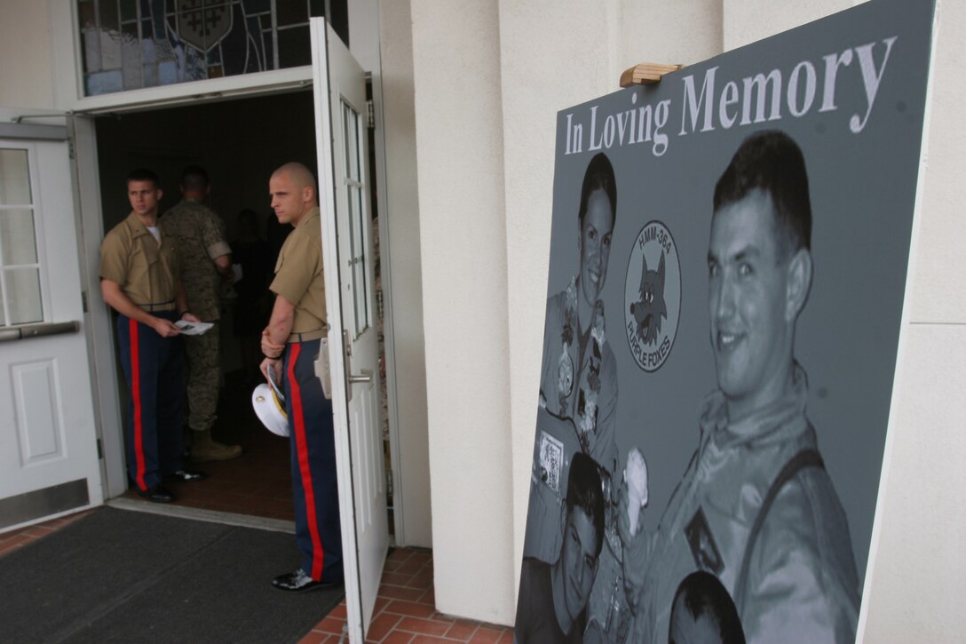 Marines of Marine Medium Helicopter Squadron 364 (HMM-364) "The Purple Foxes" usher military and civilian members into Camp Pendleton's Mainside Chapel Mar. 19. The Marines and their families came here to celebrate the lives of four HMM-364 Marines: Capt. Jennifer J. Harris, 1st Lt. Jared M. Landaker, Sgt. Pfister and Sgt. James R. Tijerna, who were killed while conducting combat operations in the Al Anbar Province of Iraq.