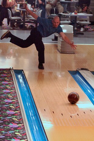 Rob Collins, 437th Services Squadron, sends his ball down the lane during the Charleston AFB intramural Bowl-off which was held Monday, Tuesday and Wednesday evenings at Starlifter Lanes.  437 SVS cleaned house by winning both the end of season Bowl-off and the regular season. (U.S. Air Force photo by Airman 1st Class Nicholas Pilch)