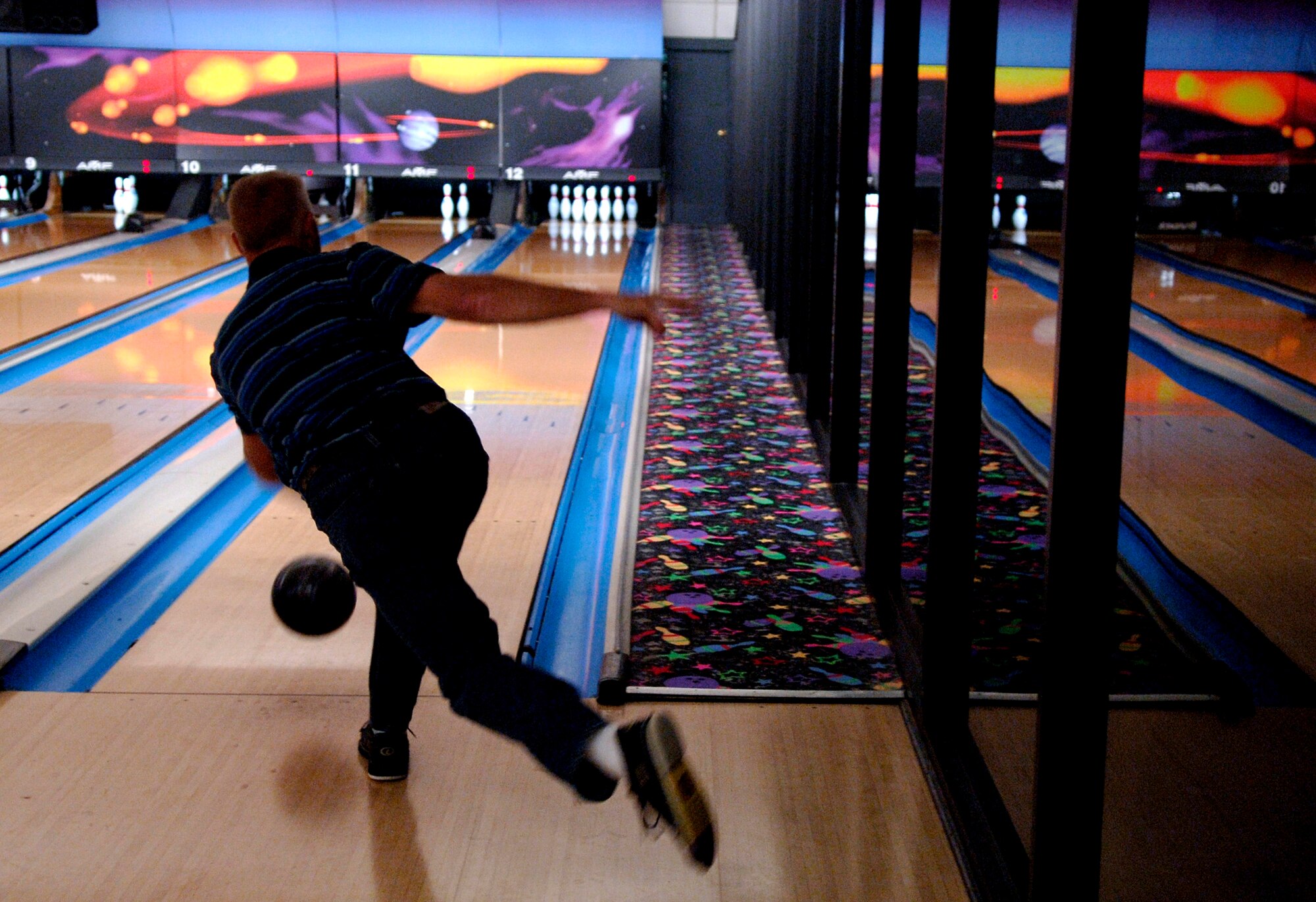 Ron Tidd, 437th Services Squadron bowling team, goes for another strike during the bowl-off Tuesday night. 


(RELEASED)(U.S. Air Force photo by Airman 1st Class Nicholas Pilch)