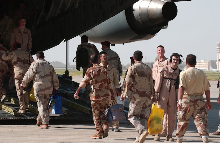 Iraqi army recruits board a C-17 Globemaster III aircraft on Sather Air Base, Iraq, Aug. 4, 2006. The C-17 is with 816th Expeditionary Air Squadron, Charleston Air Force Base, S.C. (U.S. Air Force photo by Master Sgt. Jonathan F. Doti) (Released)