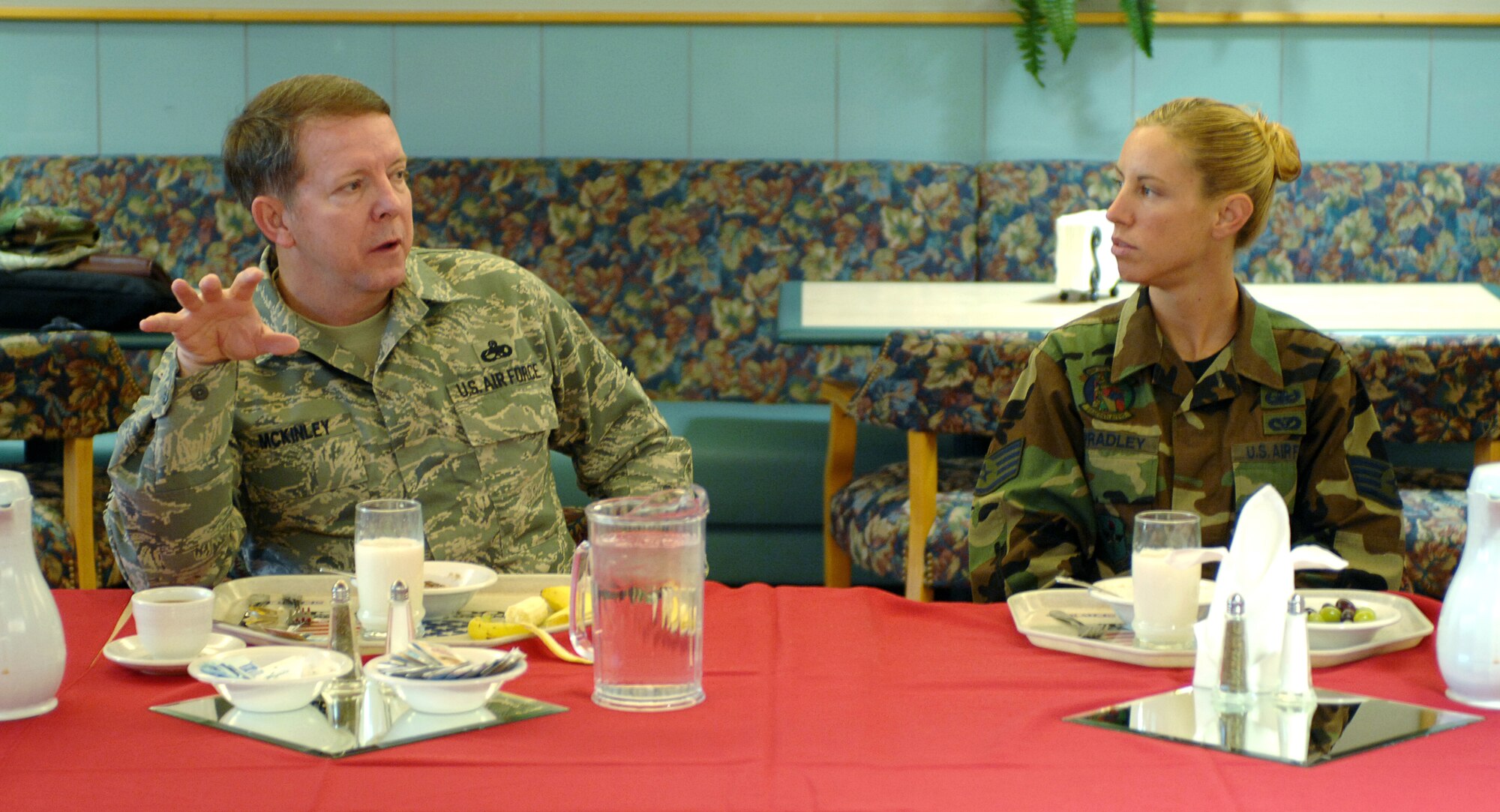 Staff Sgt. Elizabeth Spradley listens as Chief Master Sgt. of the Air Force Rodney J. McKinley meets with Luke Air Force Base, Ariz., Airmen during breakfast. The chief visited during Air Force Week, a week-long event designed to thank the community for its support and to increase public awareness of the Air Force's mission, capabilities and the professionalism of its Airmen. Sergeant Spradley is assigned to the 56th Civil Engineer Squadron explosive ordnance disposal flight.  (U.S. Air Force photo/Staff Sgt. Brian Ferguson)