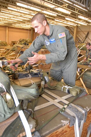 Staff Sgt. Justin Thompson, 437th Operations Support Squadron Combat Tactics Flight joint airdrop inspector, inspects an eight-foot dual row platform.
