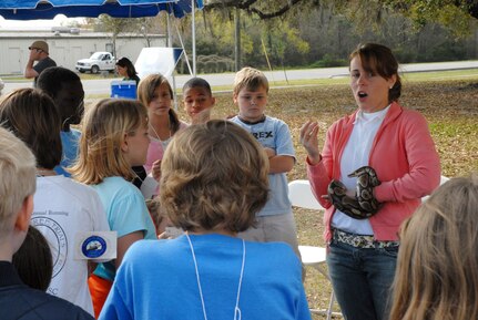 Vanessa Matvala, an Earth Day volunteer with Charleston Environmental Education speaks to Stiles Point Elementary School children about reptiles as part of the Earth Day celebration March 21. (U.S. Air Force photo/Airman Melissa B. Harper)