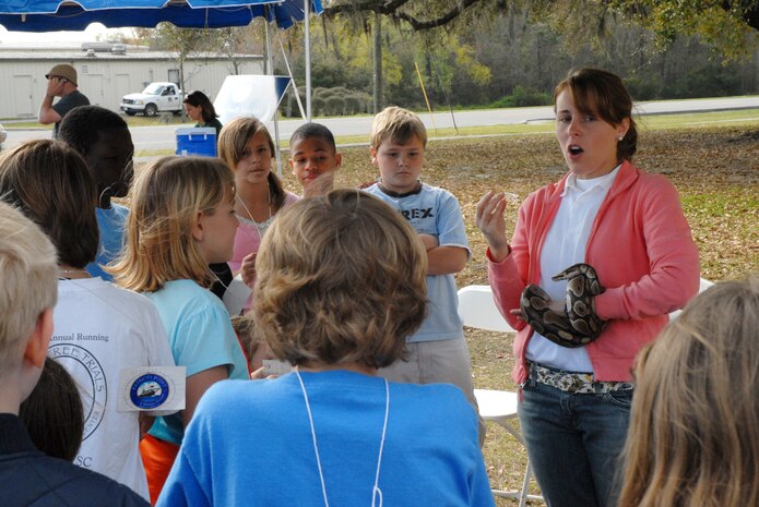 Vanessa Matvala, an Earth Day volunteer with Charleston Environmental Education speaks to Stiles Point Elementary School children about reptiles as part of the Earth Day celebration March 21. (U.S. Air Force photo/Airman Melissa B. Harper)