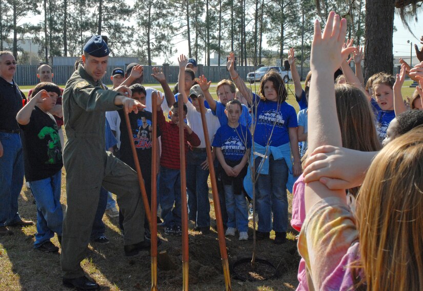 Col. Steven Harrison, 437th Airlift Wing vice commander, selects students from area schools to assist him in planting a tree for Earth Day celebrations March 21 at the base picnic grounds. Nearly 700 fifth-graders from local elementary schools attended the event. (U.S. Air Force photo/Airman Melissa B. Harper)