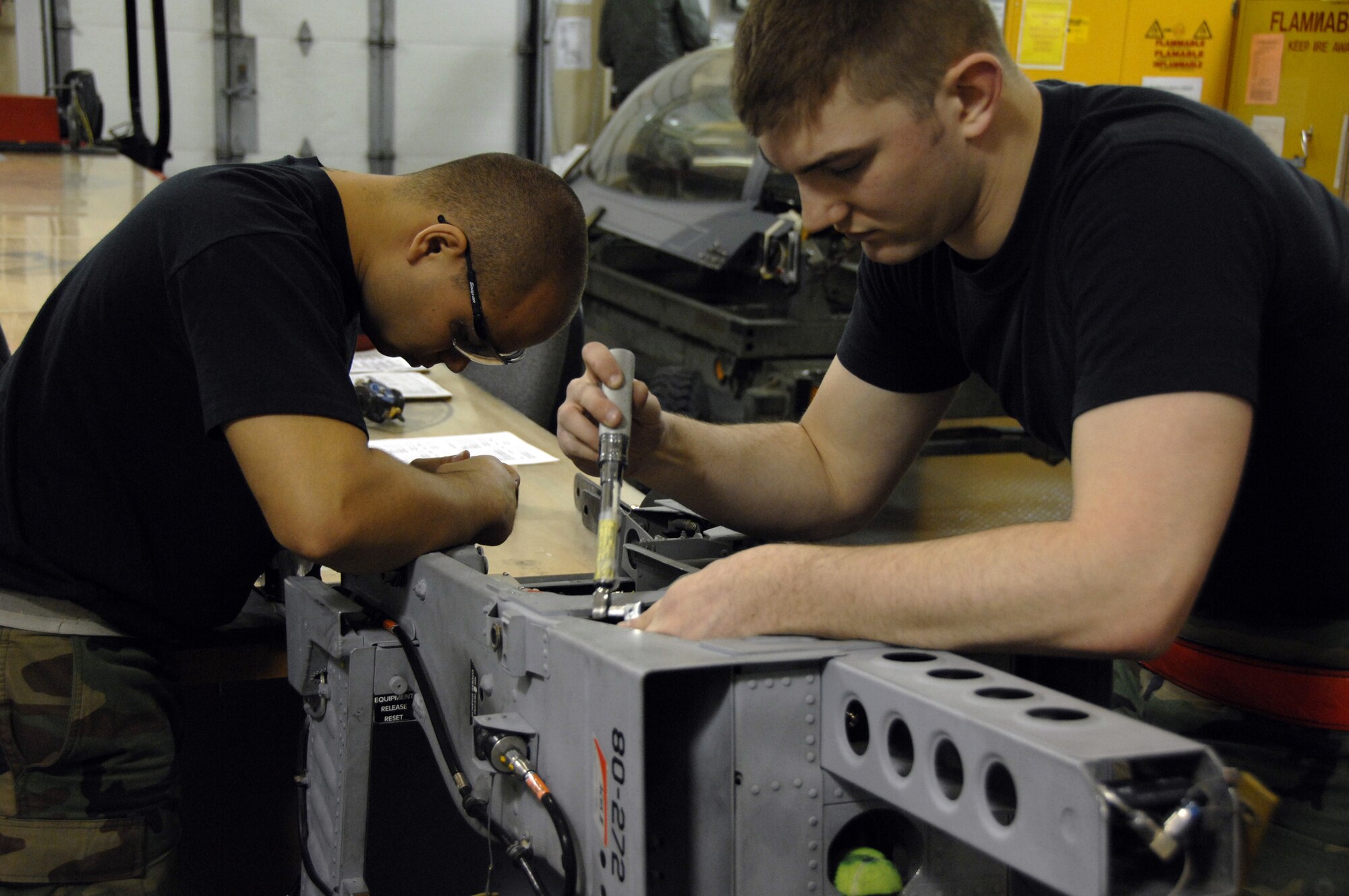 EIELSON AIR FORCE BASE, Alaska -- From left to right Senior Airman Manuel Acuna and Airman 1st Class Stephen Rehdantz, 354th Maintenance Squadron (MXS), work on an A-10 seat during its Time Compliance Technical Order 36 month seat inspection here on 21 Mar. The MXS Egress shop conducts the inspection to ensure that the seat is operating properly which usually takes 2 days from the time it is removed from the aircraft until it is reinstalled.
(U.S. Air Force Photo by Staff Sgt Joshua Strang)
