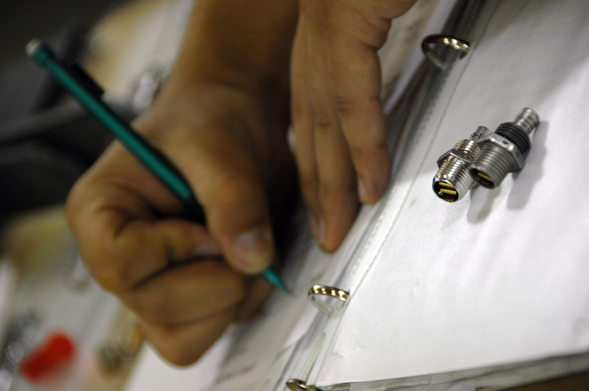 EIELSON AIR FORCE BASE, Alaska -- Senior Airman Manuel Acuna, 354th Maintenance Squadron (MXS), fills out a time change worksheet which documents the changeout between two parts during a Time Compliance Technical Order 36 month seat inspection done on an A-10 seat here 21 Mar. The MXS Egress shop conducts the inspection to ensure that the seat is operating properly which usually takes 2 days from the time it is removed from the aircraft until it is reinstalled.
(U.S. Air Force Photo by Staff Sgt Joshua Strang)