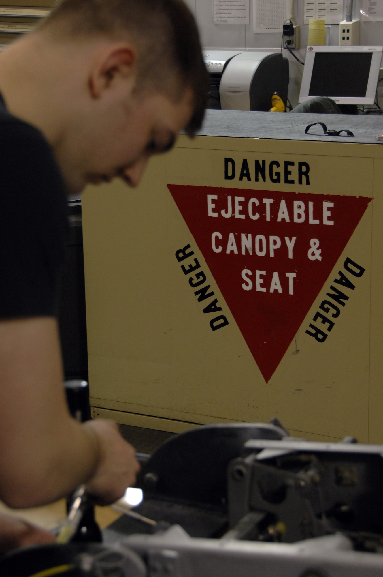 EIELSON AIR FORCE BASE, Alaska -- A hand painted sign serves as a constant reminder of the importance of the maintenance the Egress shop performs while Airman 1st Class Stephen Rehdantz, 354th Maintenance Squadron, works on a part during an A-10 seat Time Compliance Technical Order 36 month seat inspection here on 21 Mar. The MXS Egress shop conducts the inspection to ensure that the seat is operating properly which usually takes 2 days from the time it is removed from the aircraft until it is reinstalled.
(U.S. Air Force Photo by Staff Sgt Joshua Strang)