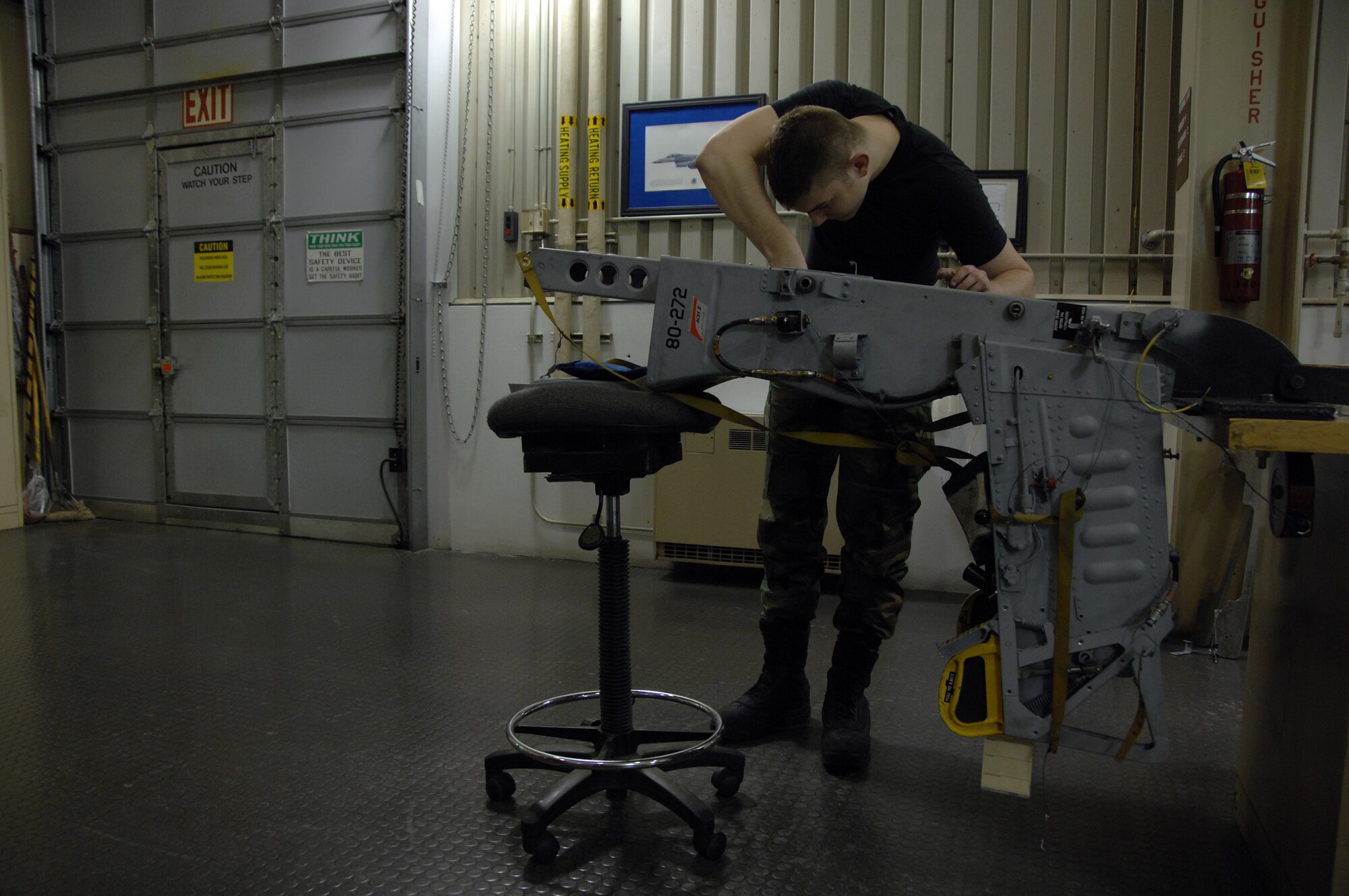 EIELSON AIR FORCE BASE, Alaska -- Airman 1st Class Stephen Rehdantz, 354th Maintenance Squadron (MXS), works on an A-10 seat during its Time Compliance Technical Order 36 month seat inspection here on 21 Mar. The MXS Egress shop conducts the inspection to ensure that the seat is operating properly which usually takes 2 days from the time it is removed from the aircraft until it is reinstalled.
(U.S. Air Force Photo by Staff Sgt Joshua Strang)