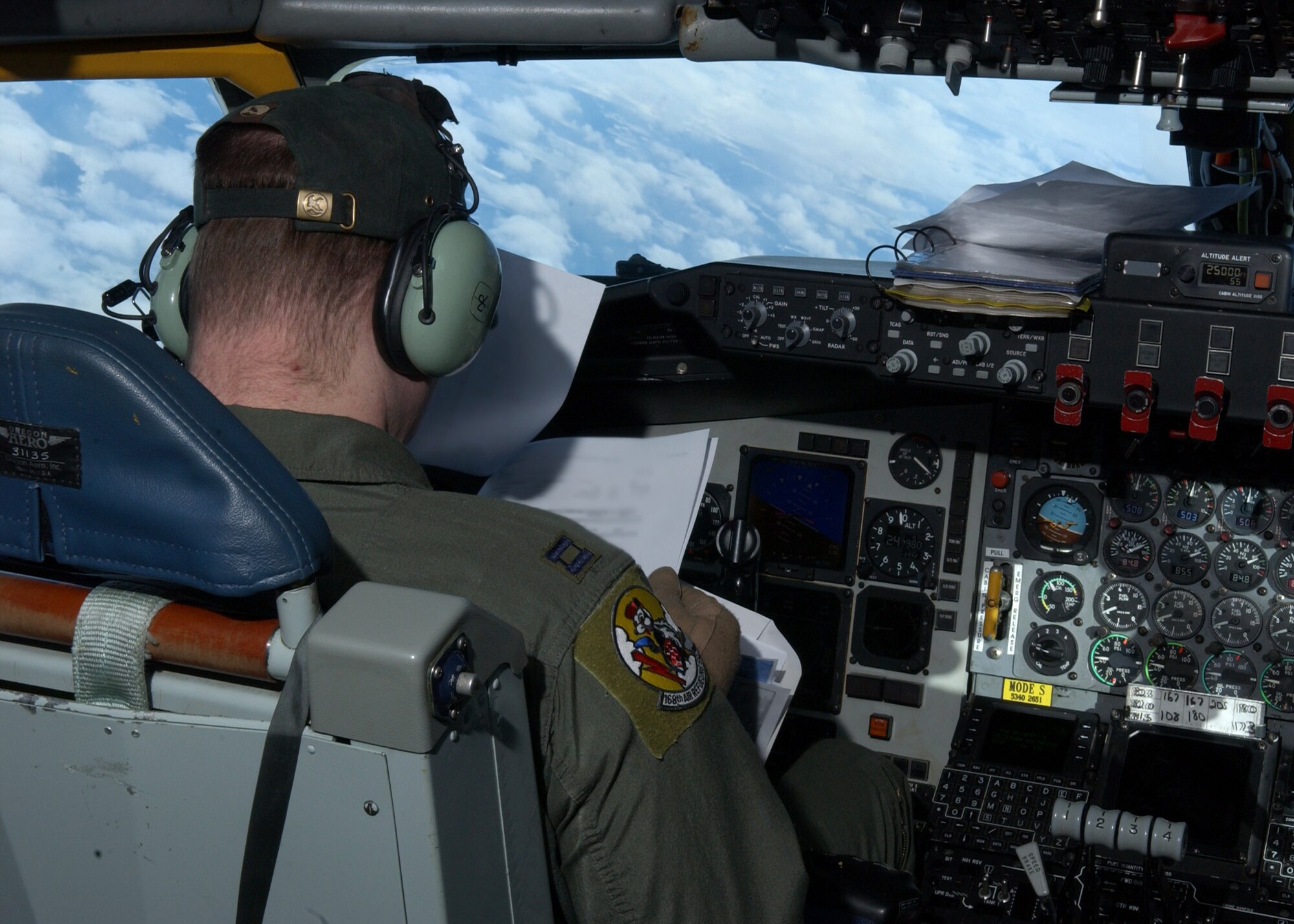 EIELSON AIR FORCE BASE, Alaska -- Captain Ryan King, 168th Air Refueling Wing, reviews the flight plan while flying over the Arctic. The 168th ARW mission is to train and equip KC-135R combat crews to provide air refueling in support of PACAF Operations Plans and worldwide refueling taskings.
 (U.S. Air Force photo by Airman 1st Class Jonathan Snyder)