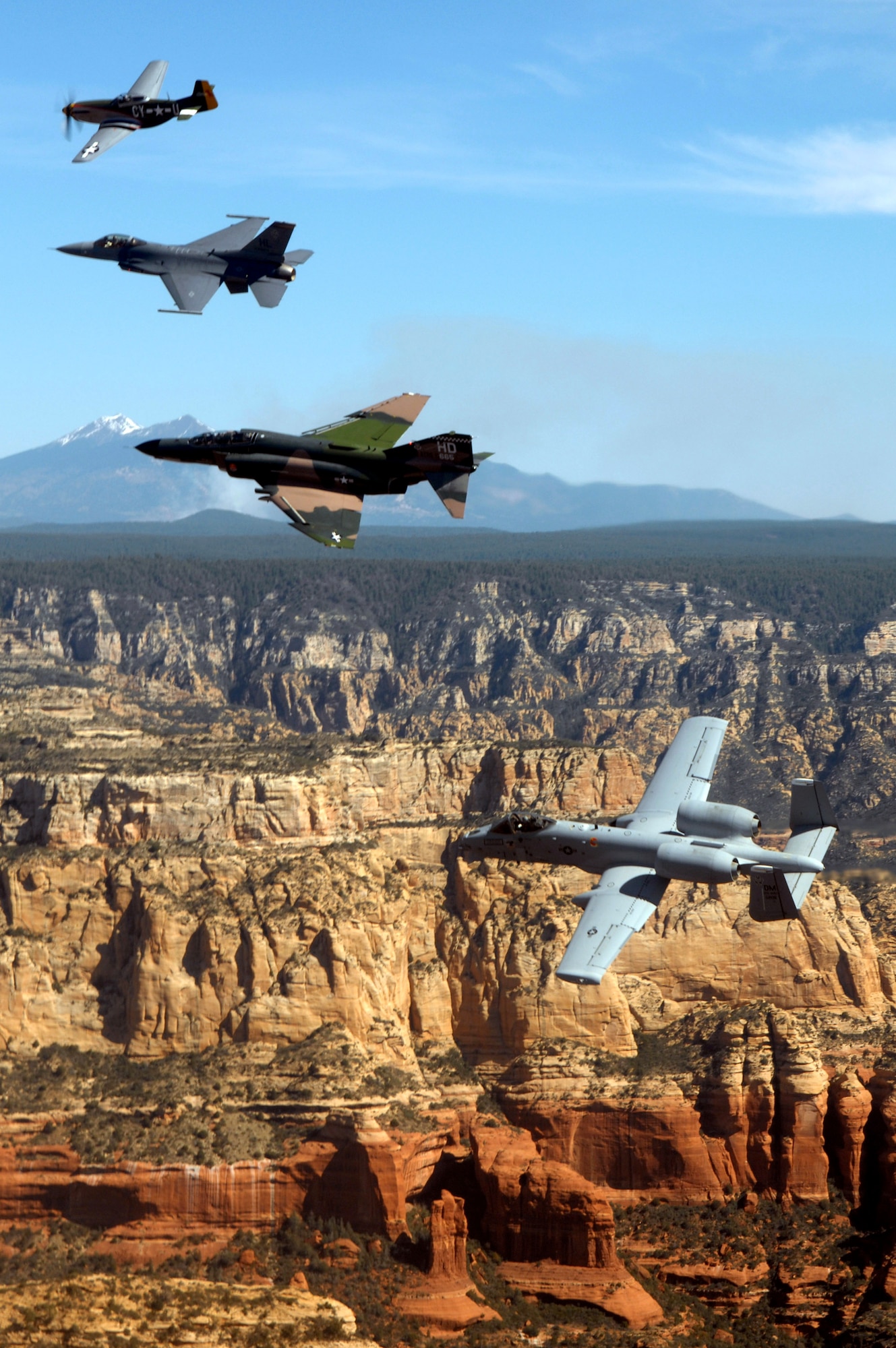 An Air Force heritage flight consisting of a P-51 Mustang, an F-4 Phantom, an A-10 Thunderbolt and an F-16 Fighting Falcon fly over the Arizona desert on March 19 above Sadona. The flight was part of the events taking place in Phoenix for the first Air Force Week celebration of the year. (U.S. Air Force photo/Tech. Sgt. Justin D. Pyle) 